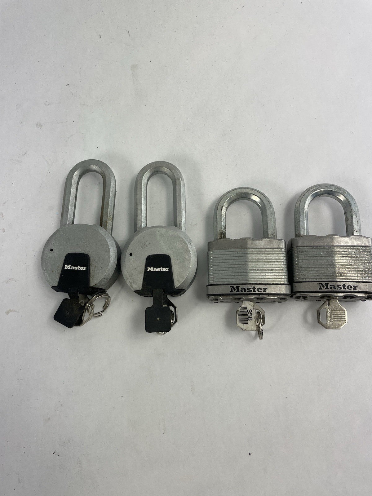Lot of 4: Master Solid Steel Boron Carbide Contractor Grade Padlock with Keys