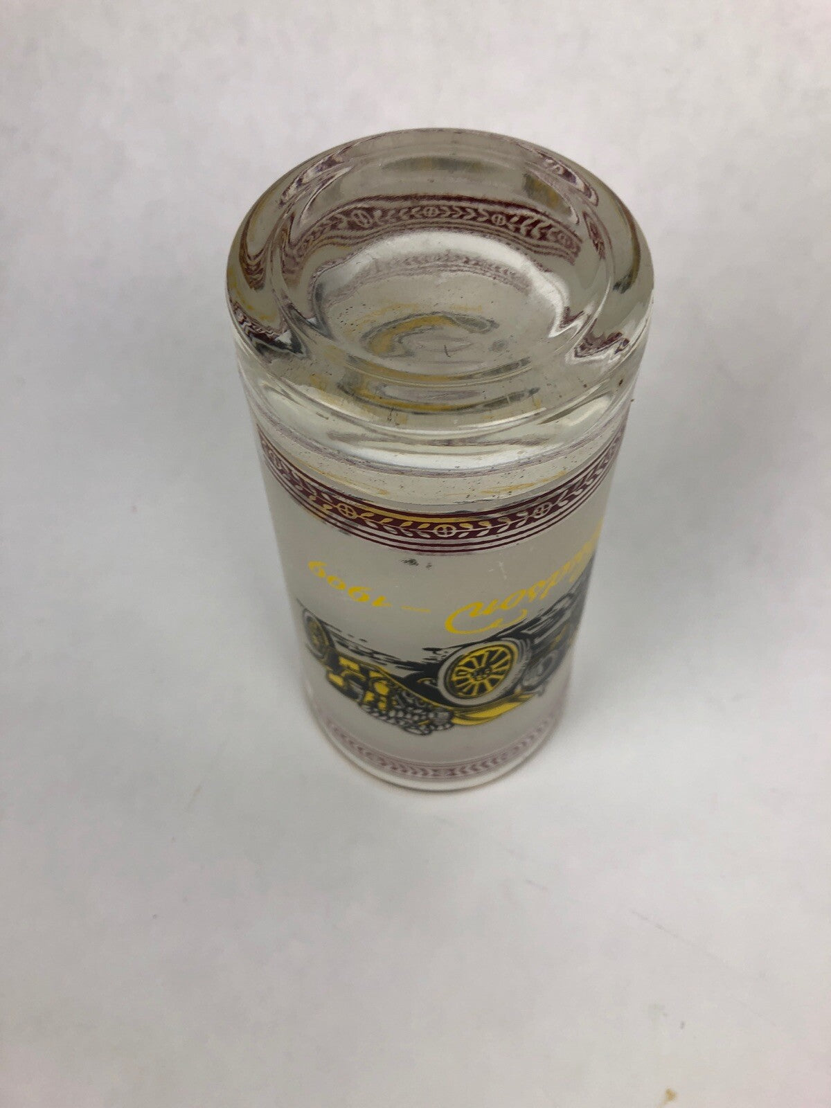 Vintage frosted cocktail glass featuring 1909 Hudson and 1914 Dodge with gold rim.