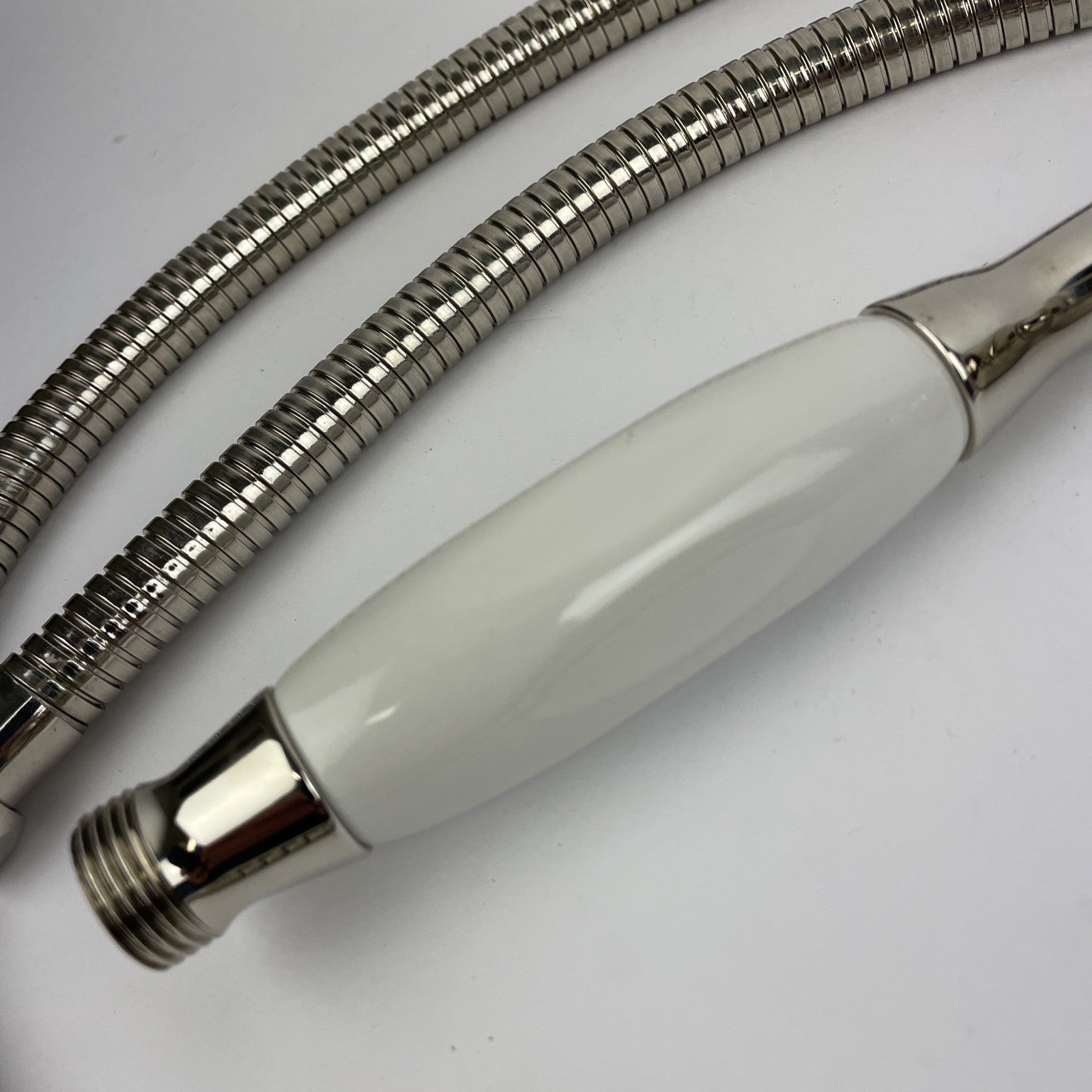 Designer Cooper chrome hand shower with porcelain handle and stainless steel hose