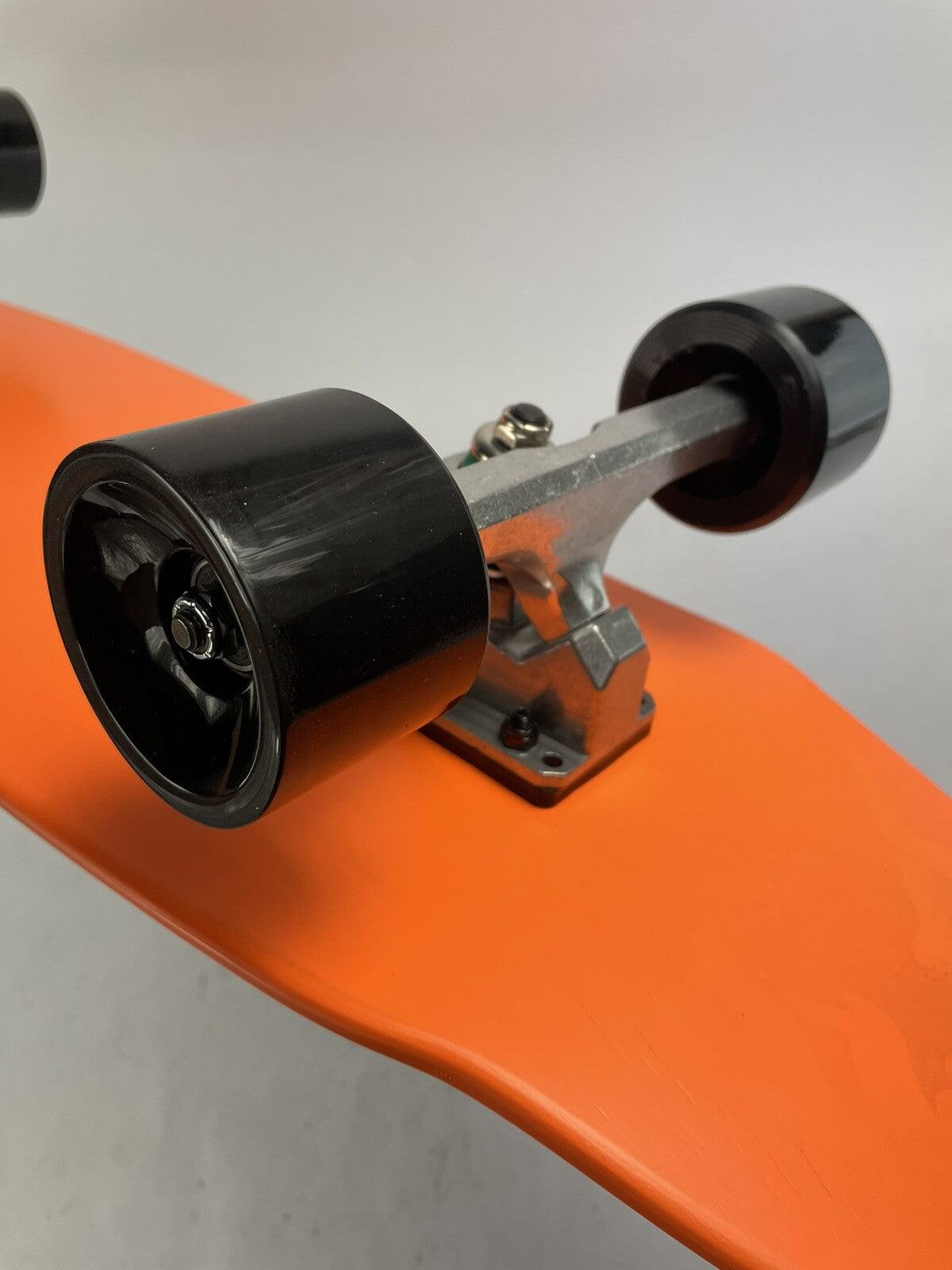 Orange Surf Fish Blank 10-inch complete skateboard with reverse kingpin trucks, 70mm wheels, and ABEC-7 bearings.