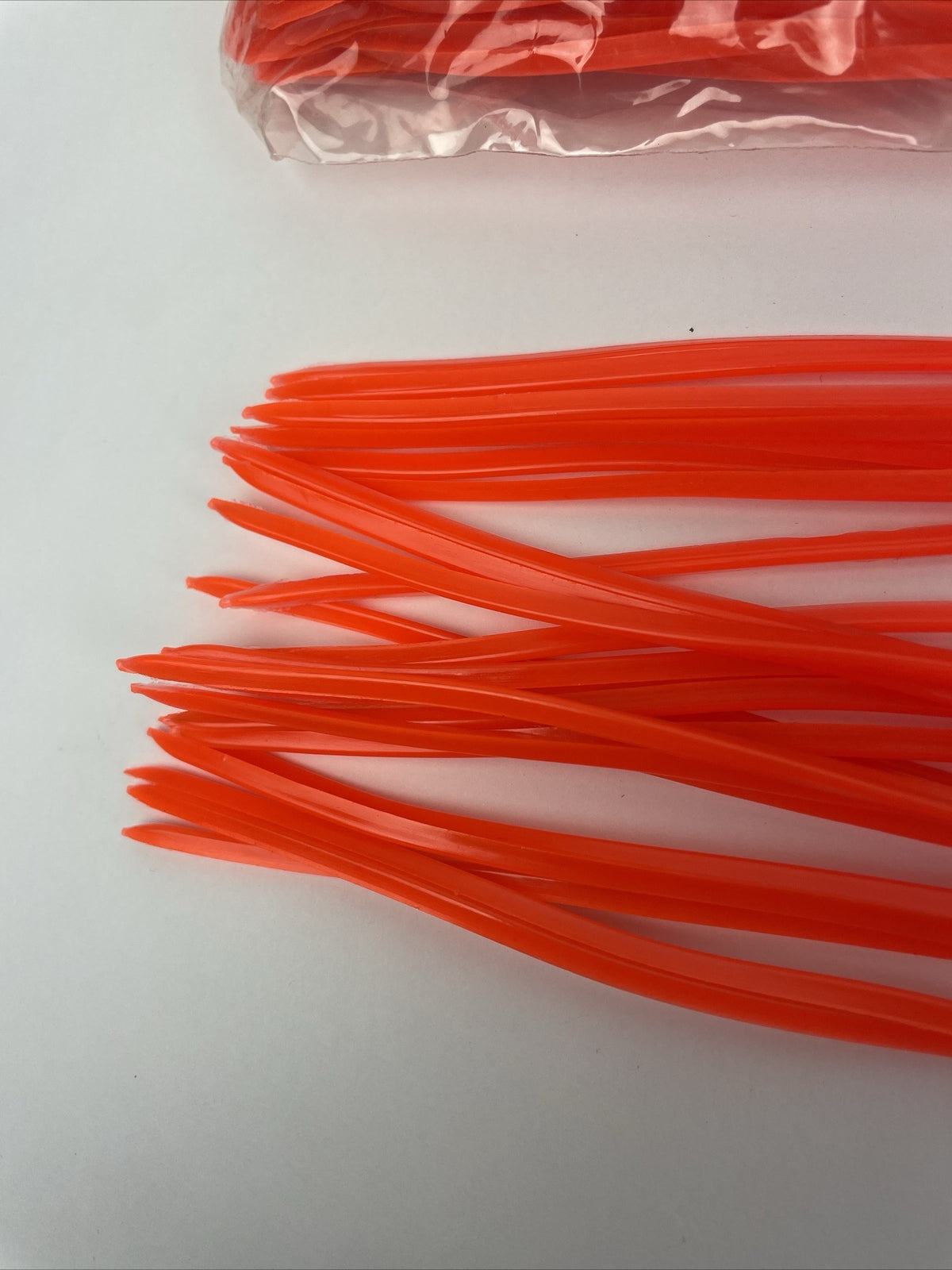 Newell MFG 10-pack orange offshore trolling fishing lure skirts for tuna marlin and wahoo