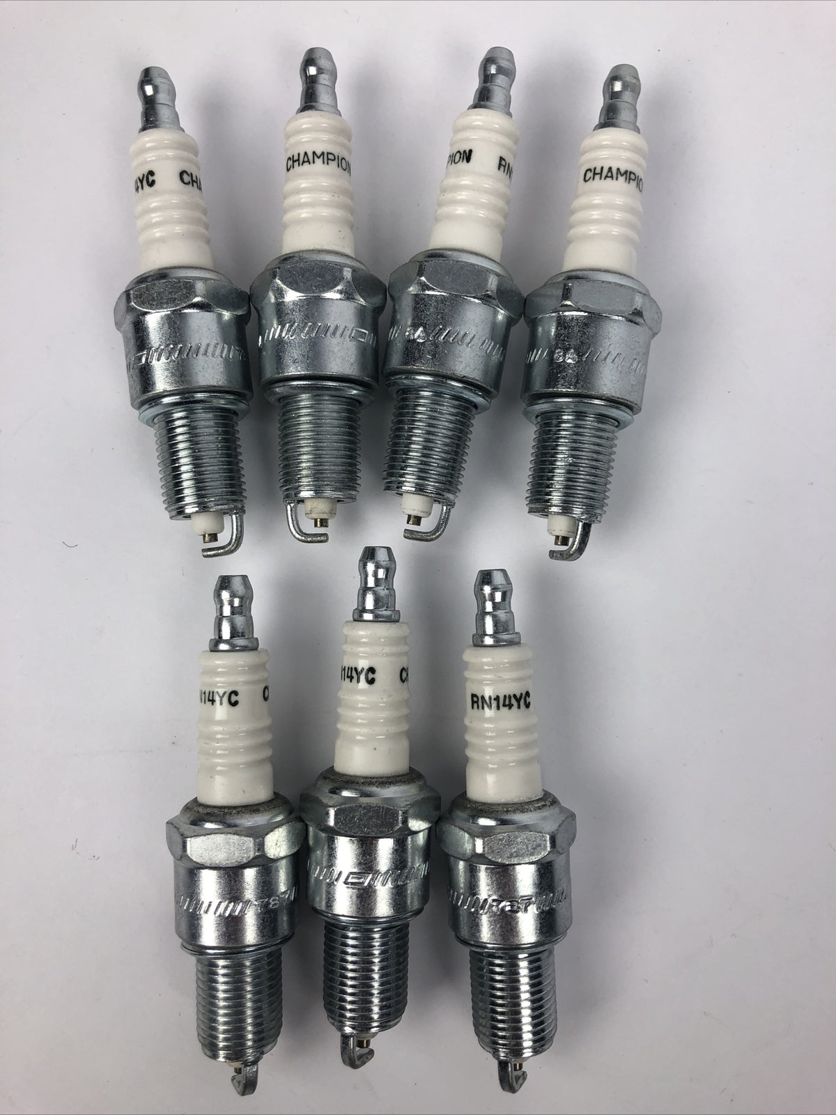 Lot of 7 Champion RN14YC spark plugs NAPA 405 replacement ignition set automotive engine tune up plugs