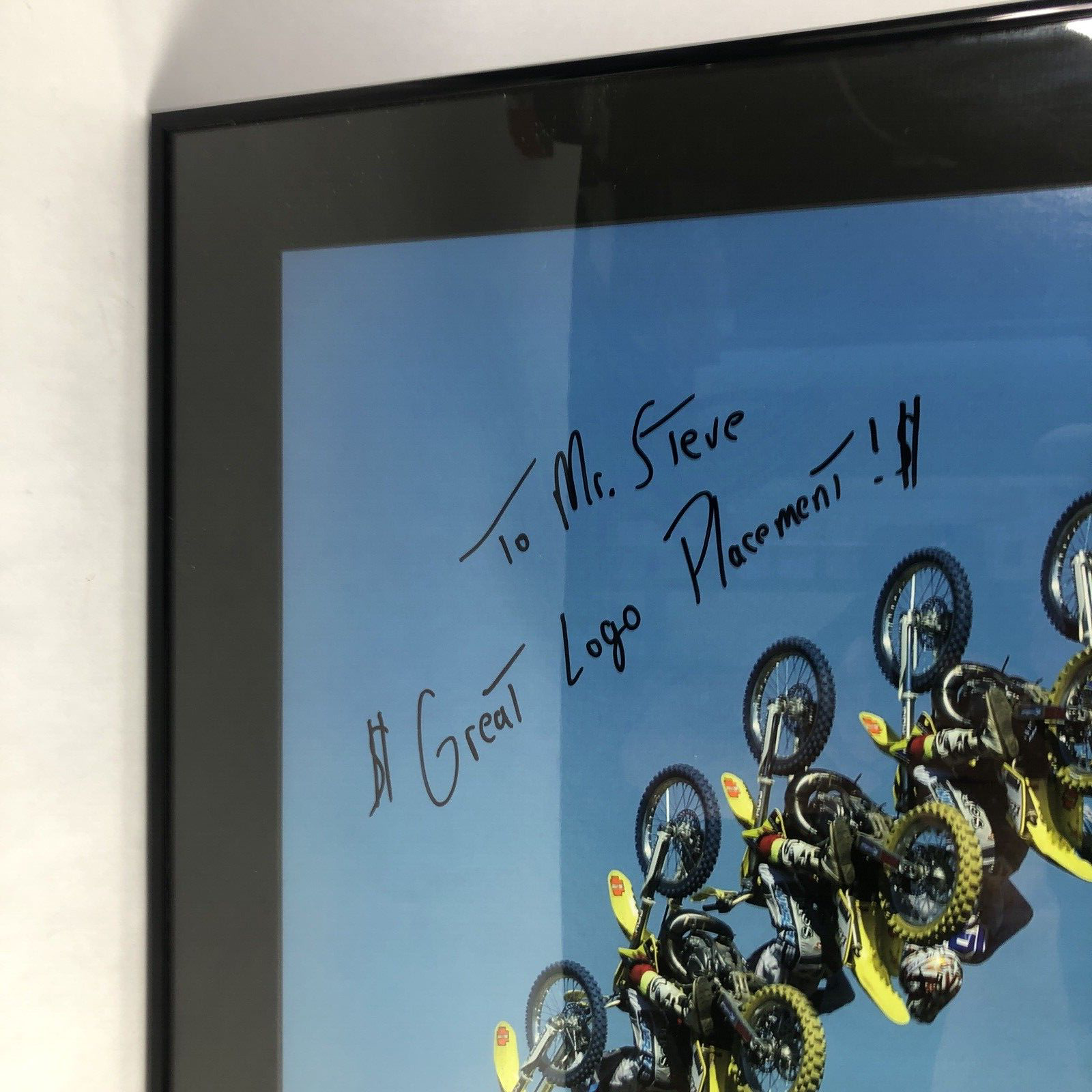 Travis Pastrana signed framed No Fear backflip poster measuring 42.5 by 30.5 inches.