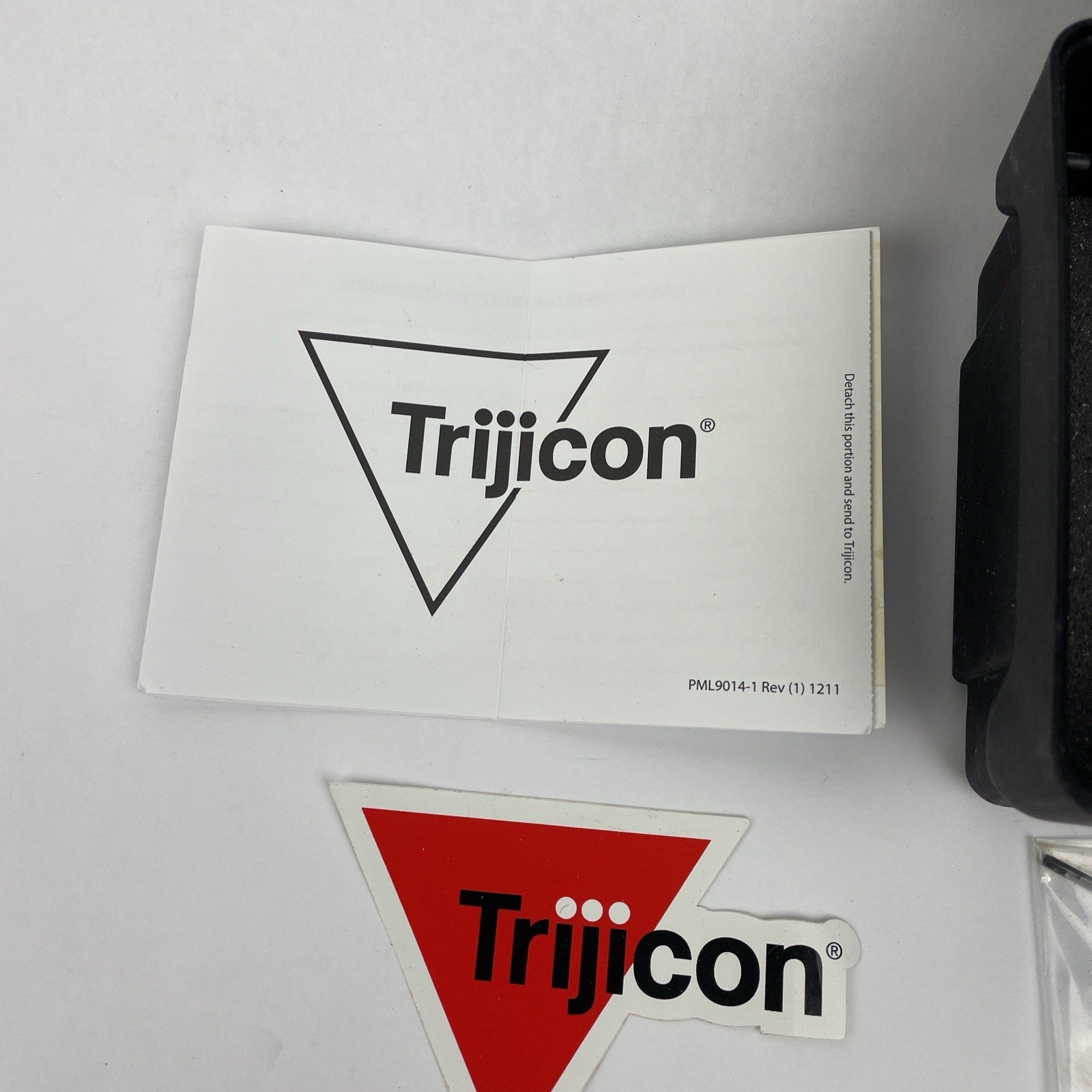 Trijicon OEM hard travel case with foam insert measuring 5.5 x 5 inches