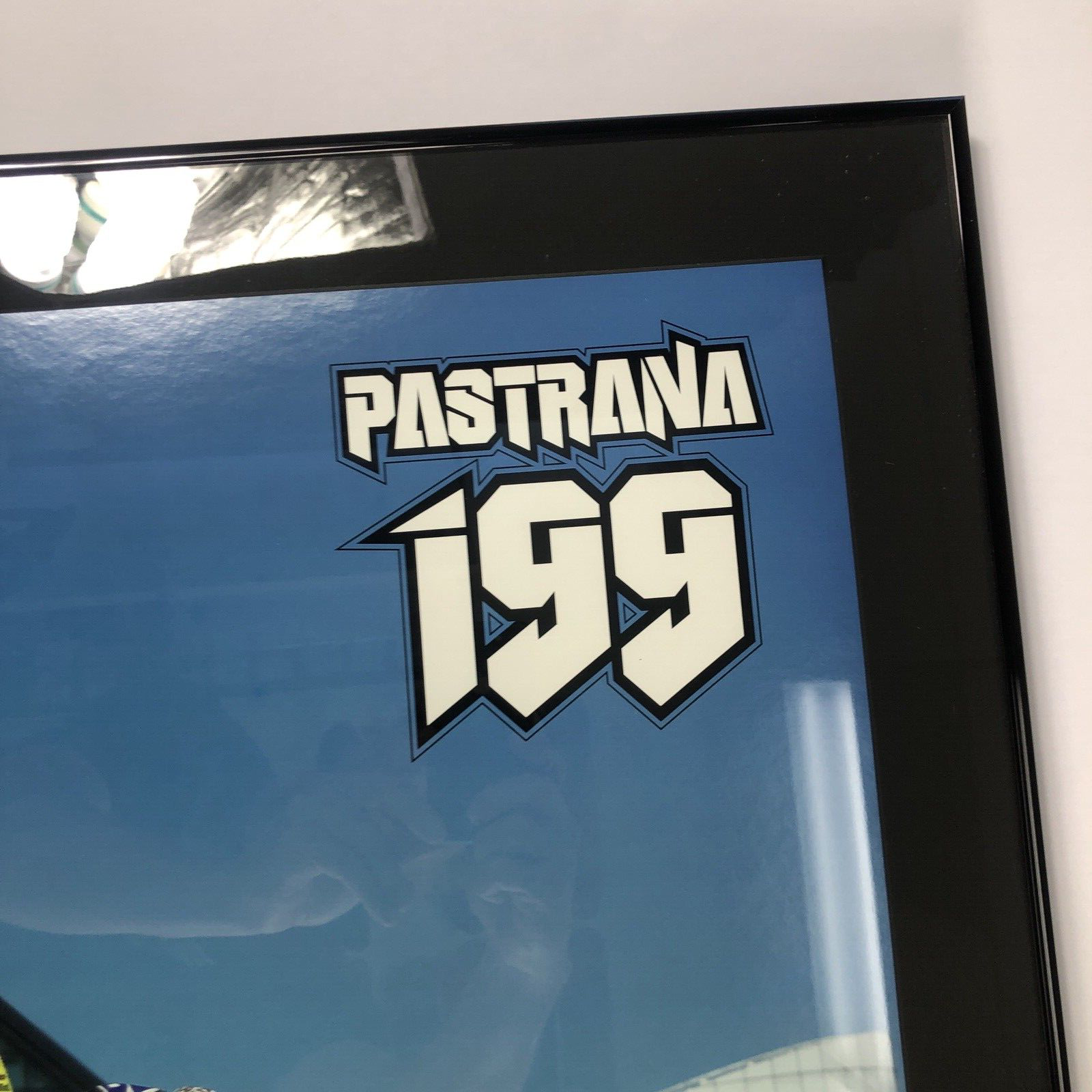 Travis Pastrana signed framed No Fear backflip poster measuring 42.5 by 30.5 inches.