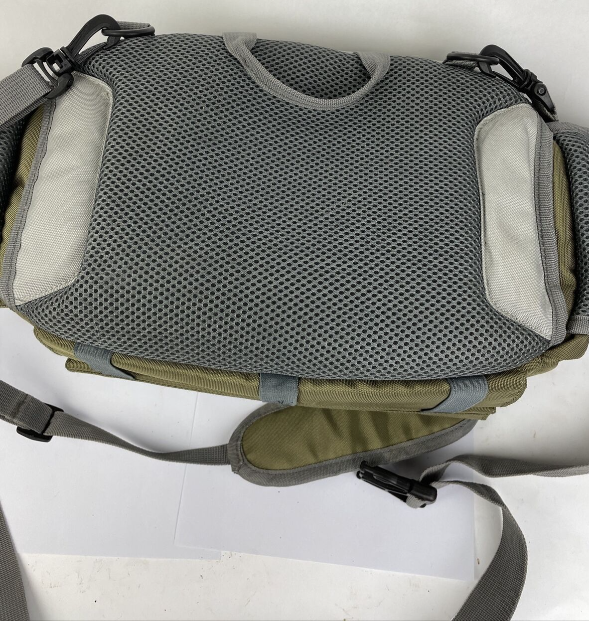 Cabela's Advanced Anglers green waist pack with extras for fly fishing and hiking.