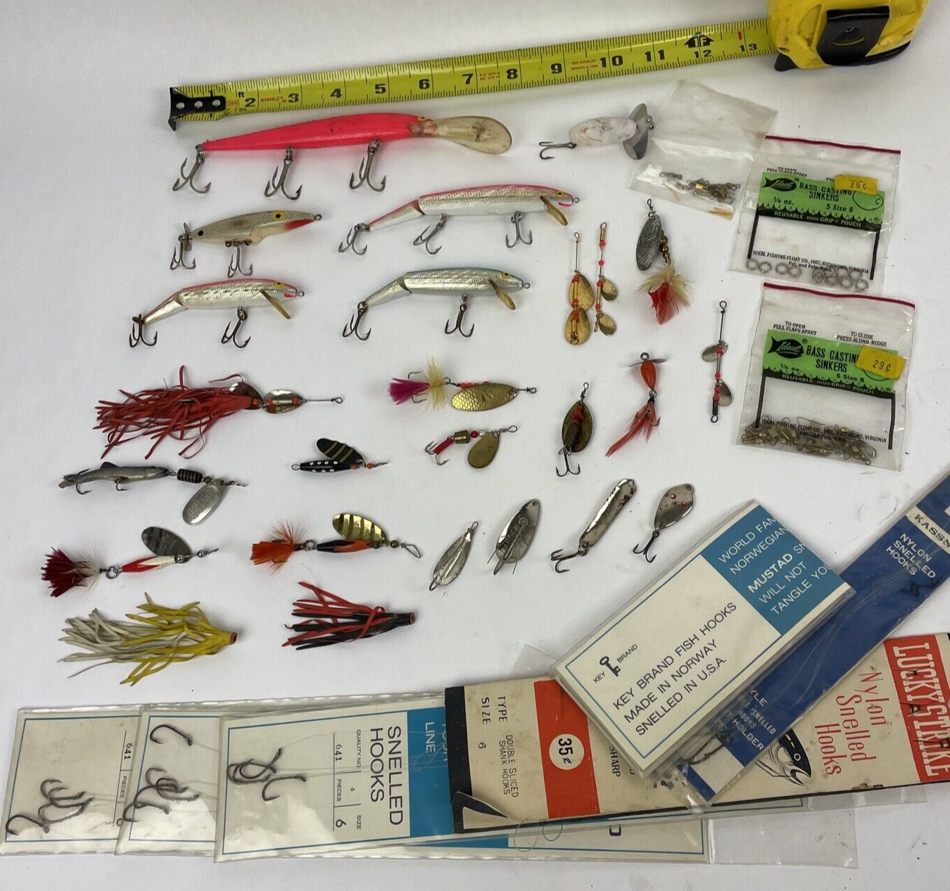 Vintage fishing lure lot with Jitterbug Rebel Floater Mepps and Shyster lures for trout crappie and bass fishing