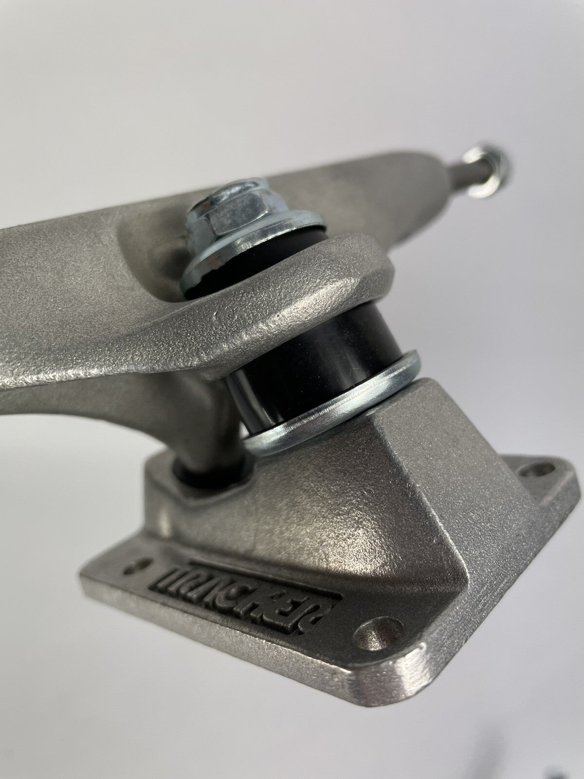 Tracker Axis polished skateboard trucks with 129mm axle, 5.0-inch hanger, and hollow kingpin for lightweight performance.