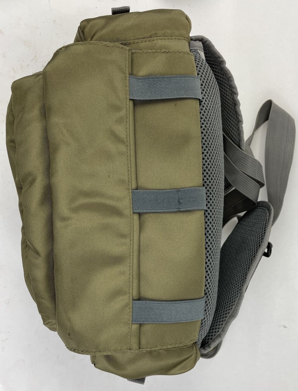 Cabela's Advanced Anglers green waist pack with extras for fly fishing and hiking.