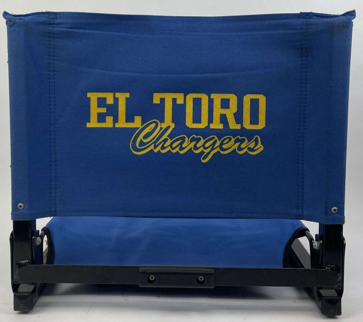 The Stadium Chair Company blue cushioned bleacher seat with EL TORO California branding.