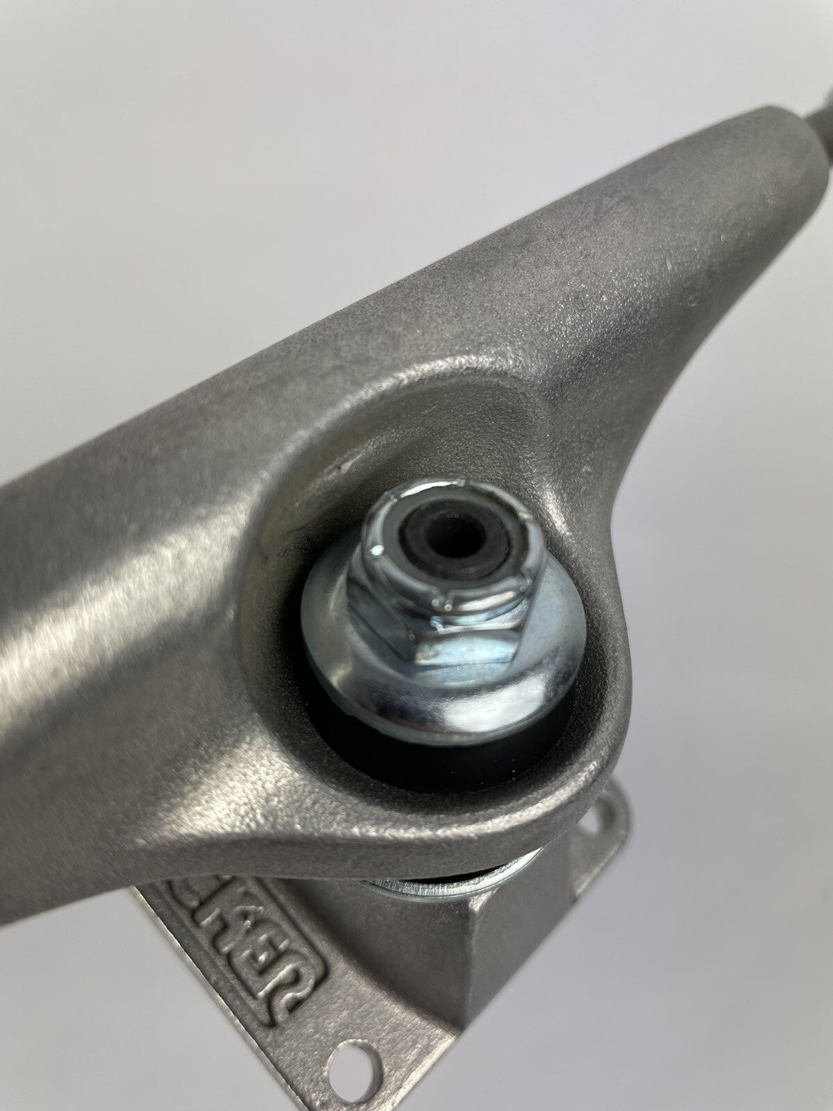 Pair of Tracker Axis 139mm polished skateboard trucks with 8.25-inch axle width and hollow kingpin for street and park skating.