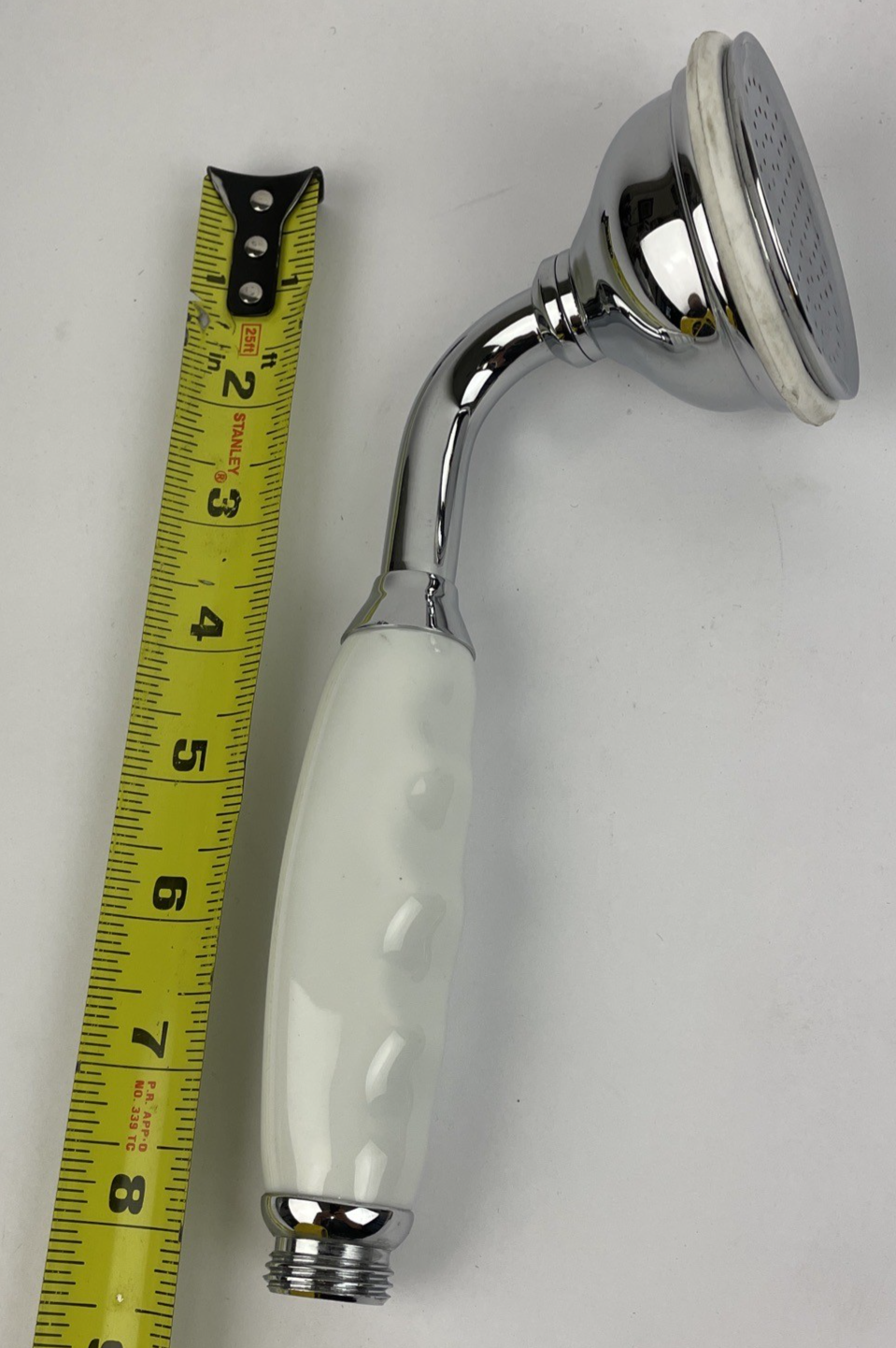Designer Cooper hand shower with porcelain handle and polished chrome finish for bathroom shower system