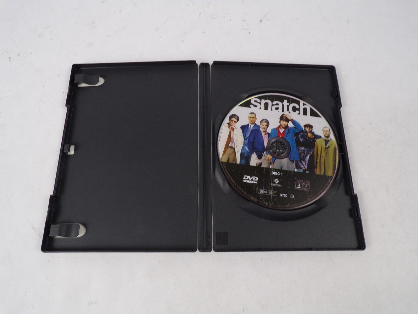 Snatch "A Rock-'em Sock- 'em Caper With Energy To Spare." Benicid Del DVD Movies