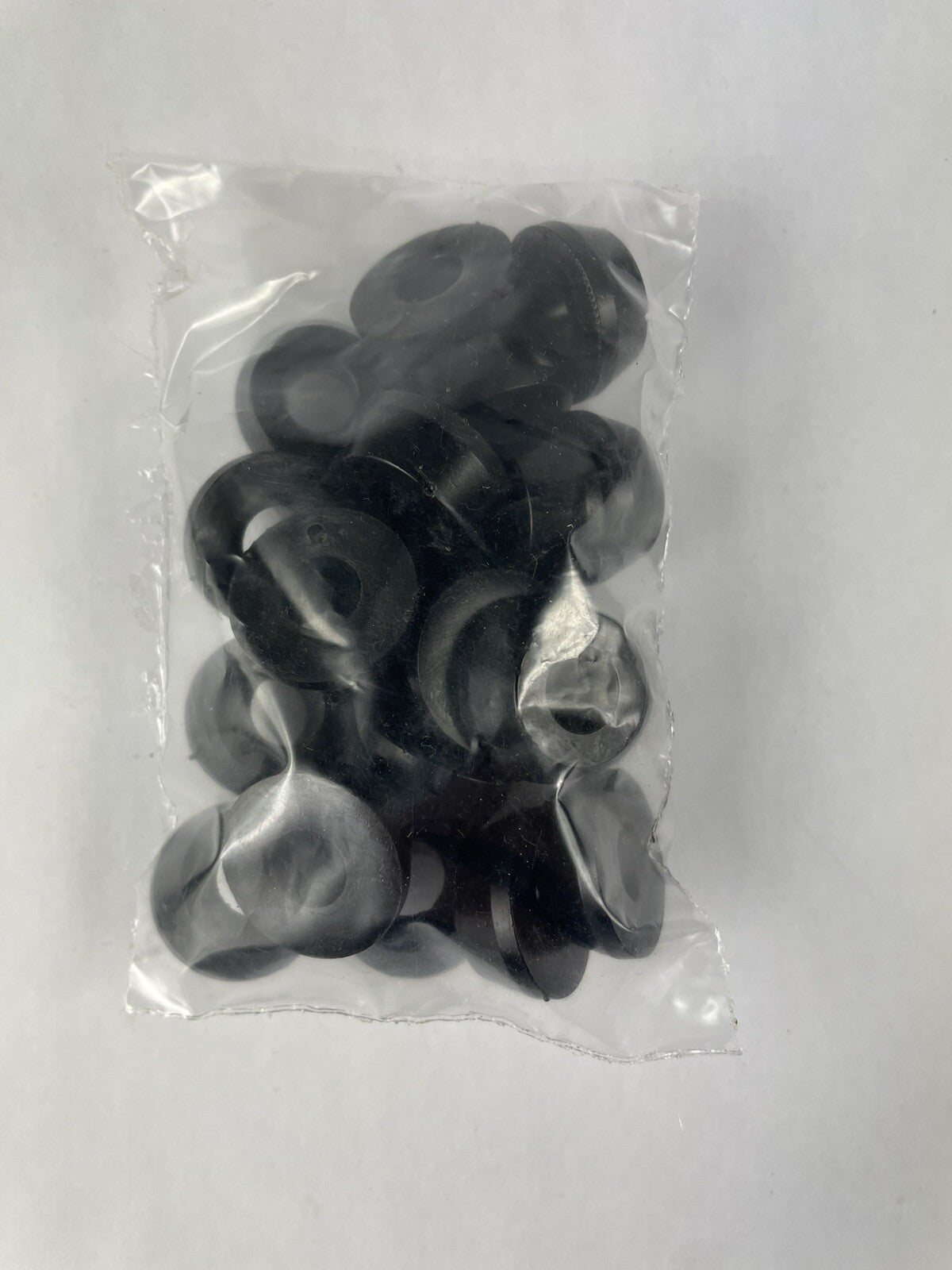 Black skateboard truck upper replacement bushings bulk kit with 20 polyurethane pieces for standard skateboard trucks.
