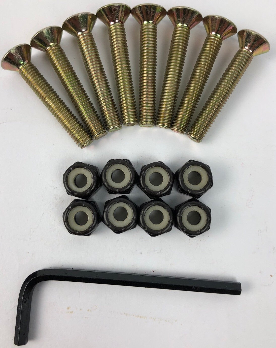 NOS Grind King Skateboards 1.25-inch gold Allen key skateboard mounting hardware set with hex-head bolts and nuts.