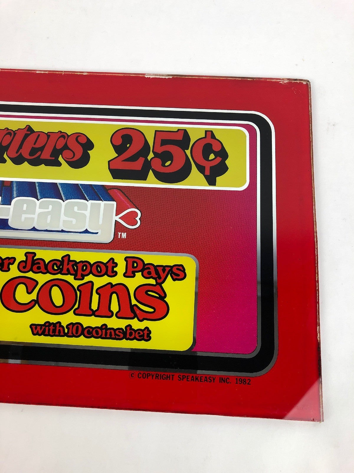 Vintage 1982 Speakeasy casino slot machine payout printed glass panel.