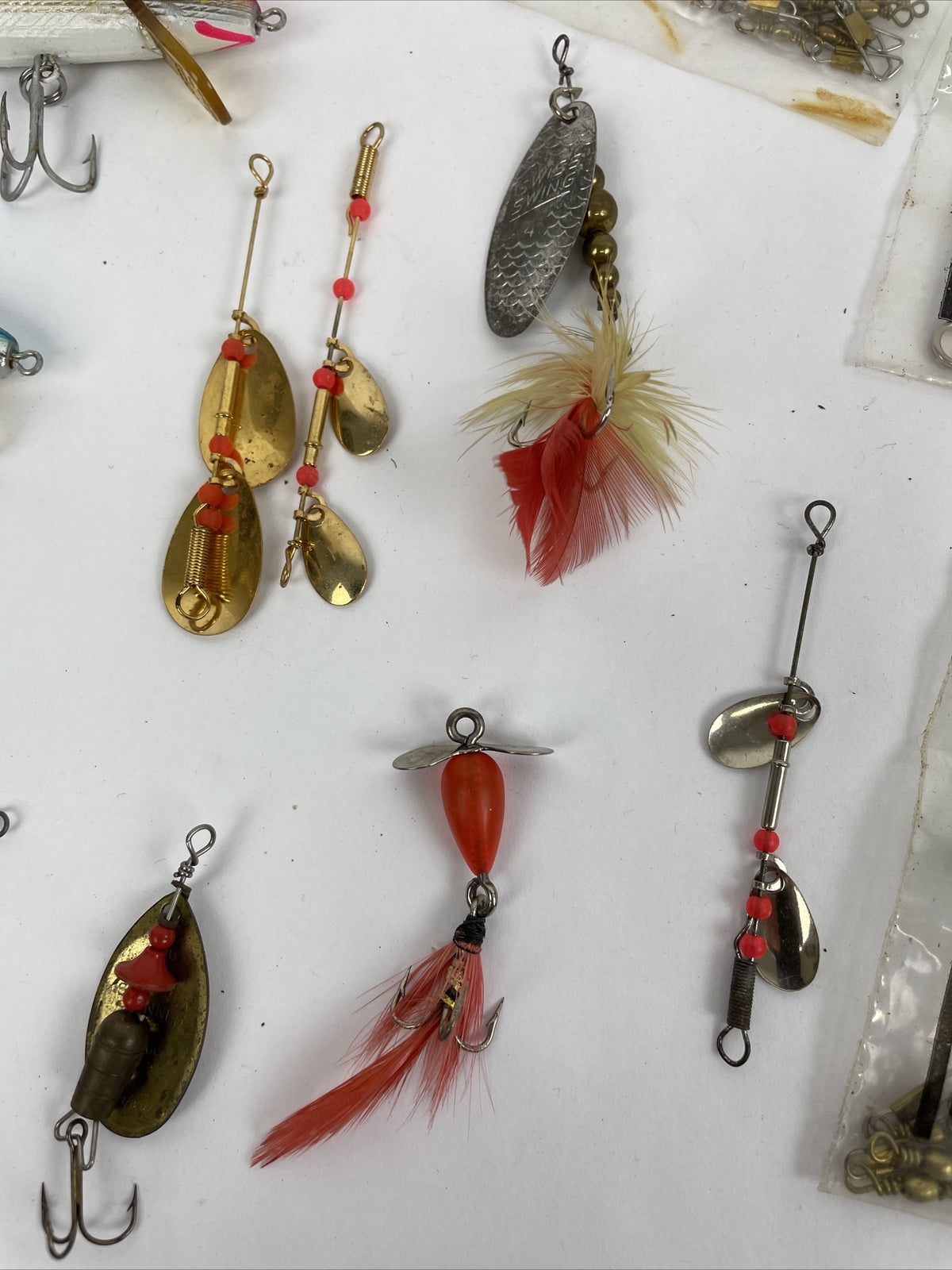Vintage fishing lure lot with Jitterbug Rebel Floater Mepps and Shyster lures for trout crappie and bass fishing