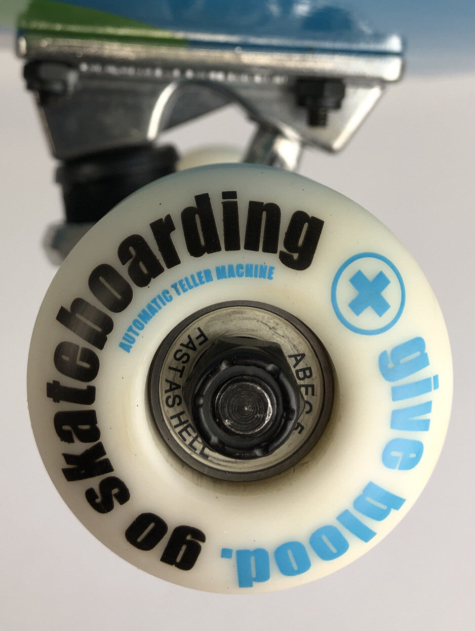 ATM Click Have a Nice Day 8-inch complete skateboard with Black Smith trucks and 52mm wheels.
