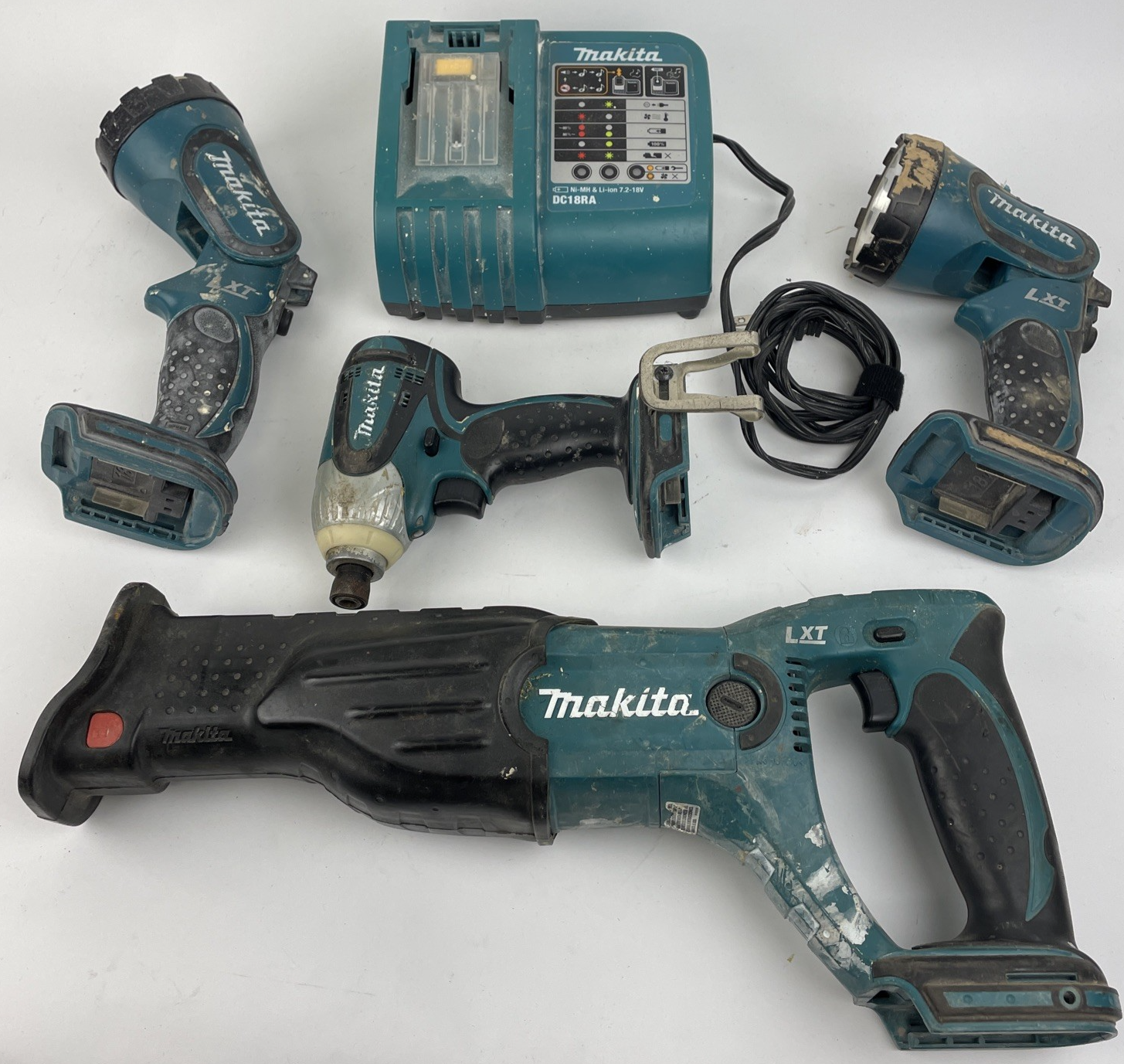 Makita 18V LXT Cordless 1/4” Impact Driver, Reciprocating Saw, 2 Lights, Charger