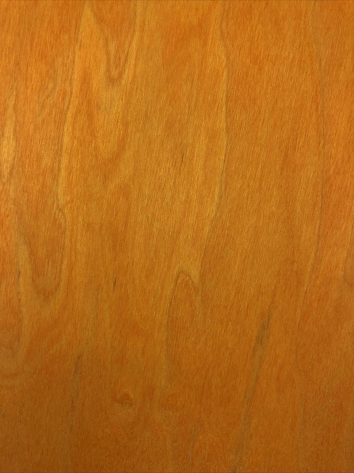 Blank uncut 10 x 34-inch orange stain skateboard deck with 14.25-inch wheelbase.