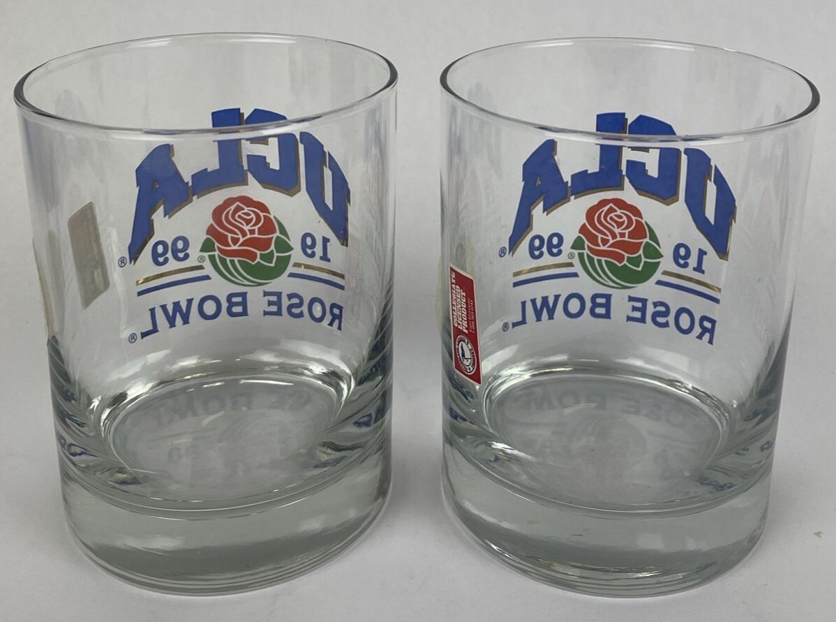 Set of two vintage UCLA Rose Bowl 1999 blue print bar glasses with gold trim.