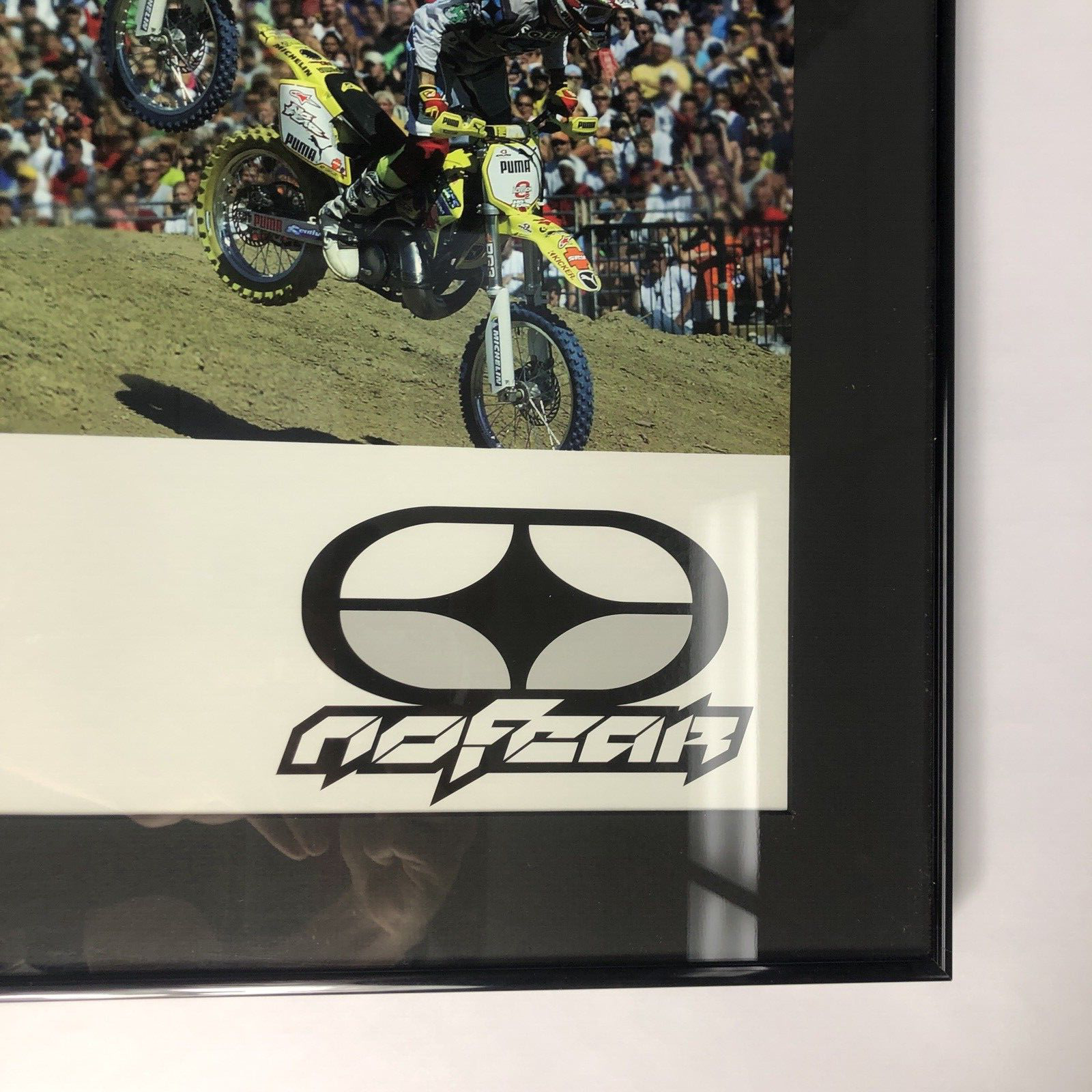 Travis Pastrana signed framed No Fear backflip poster measuring 42.5 by 30.5 inches.