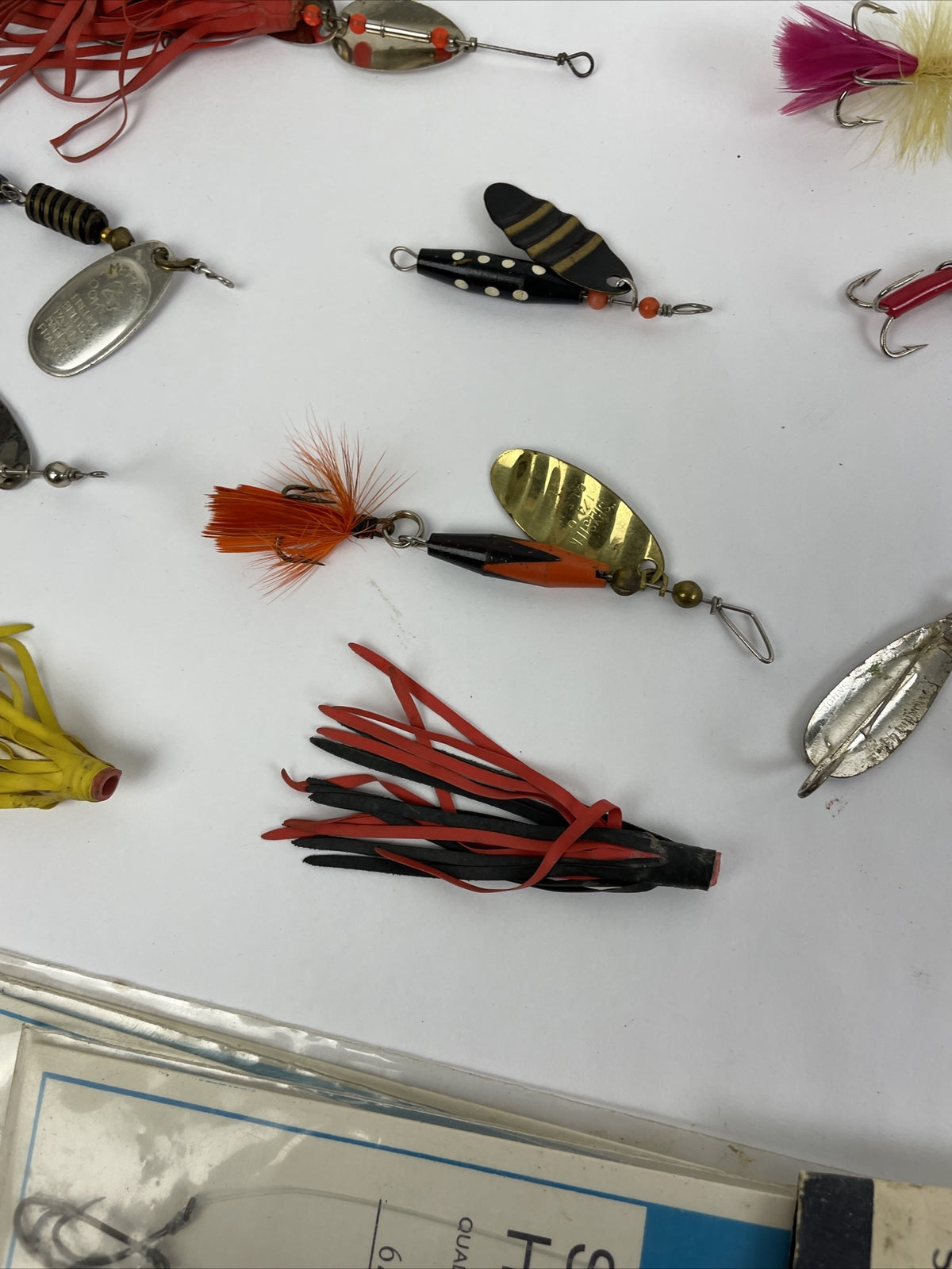 Vintage fishing lure lot with Jitterbug Rebel Floater Mepps and Shyster lures for trout crappie and bass fishing