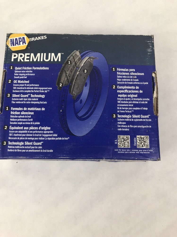 NAPA SS7787X front ceramic disc brake pad set OEM replacement brake pads with anti-squeal shims for automotive front disc brake systems.