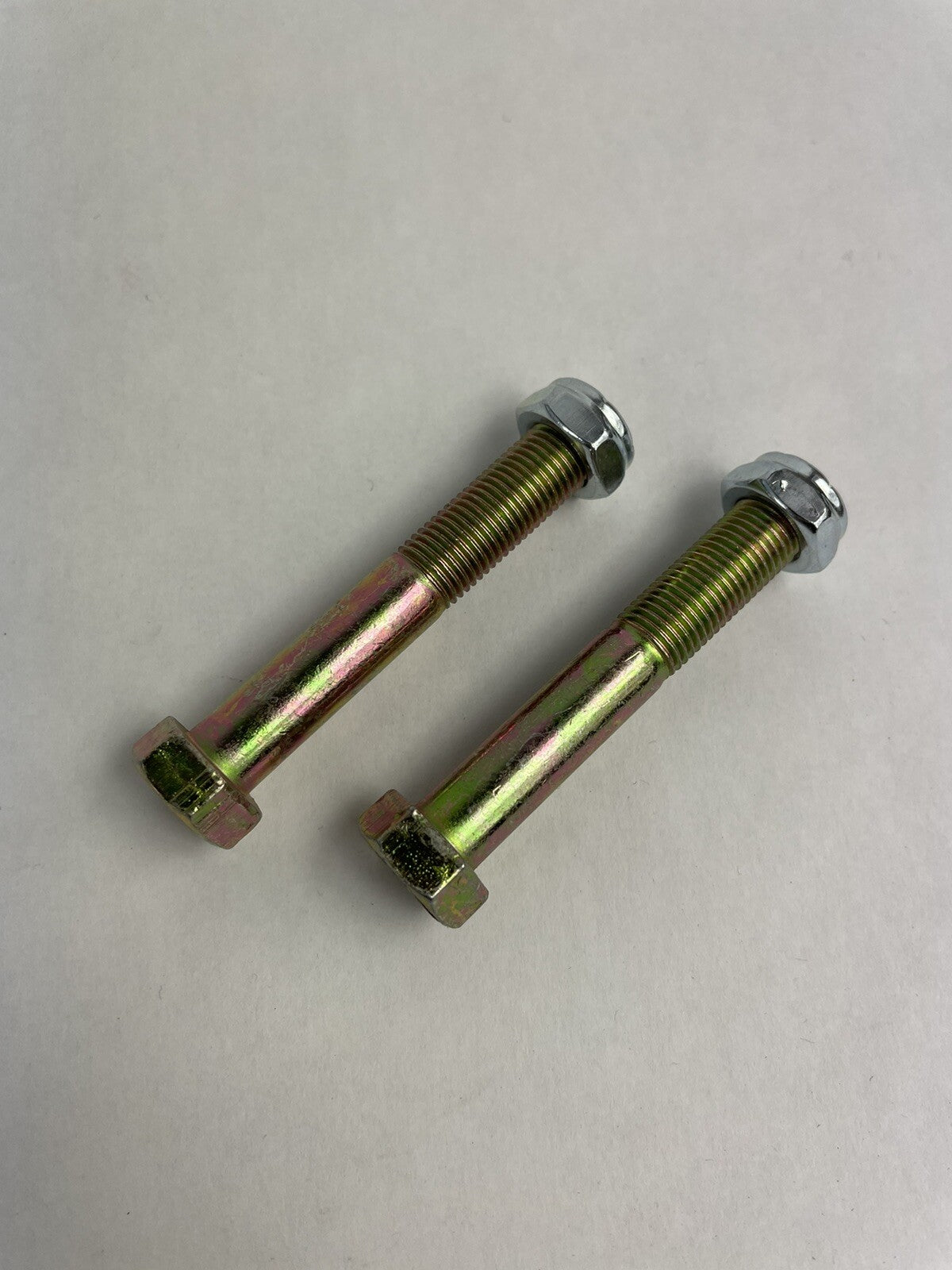 Grind King 2.5-inch skateboard and longboard kingpins with nylon locking nuts, set of two.