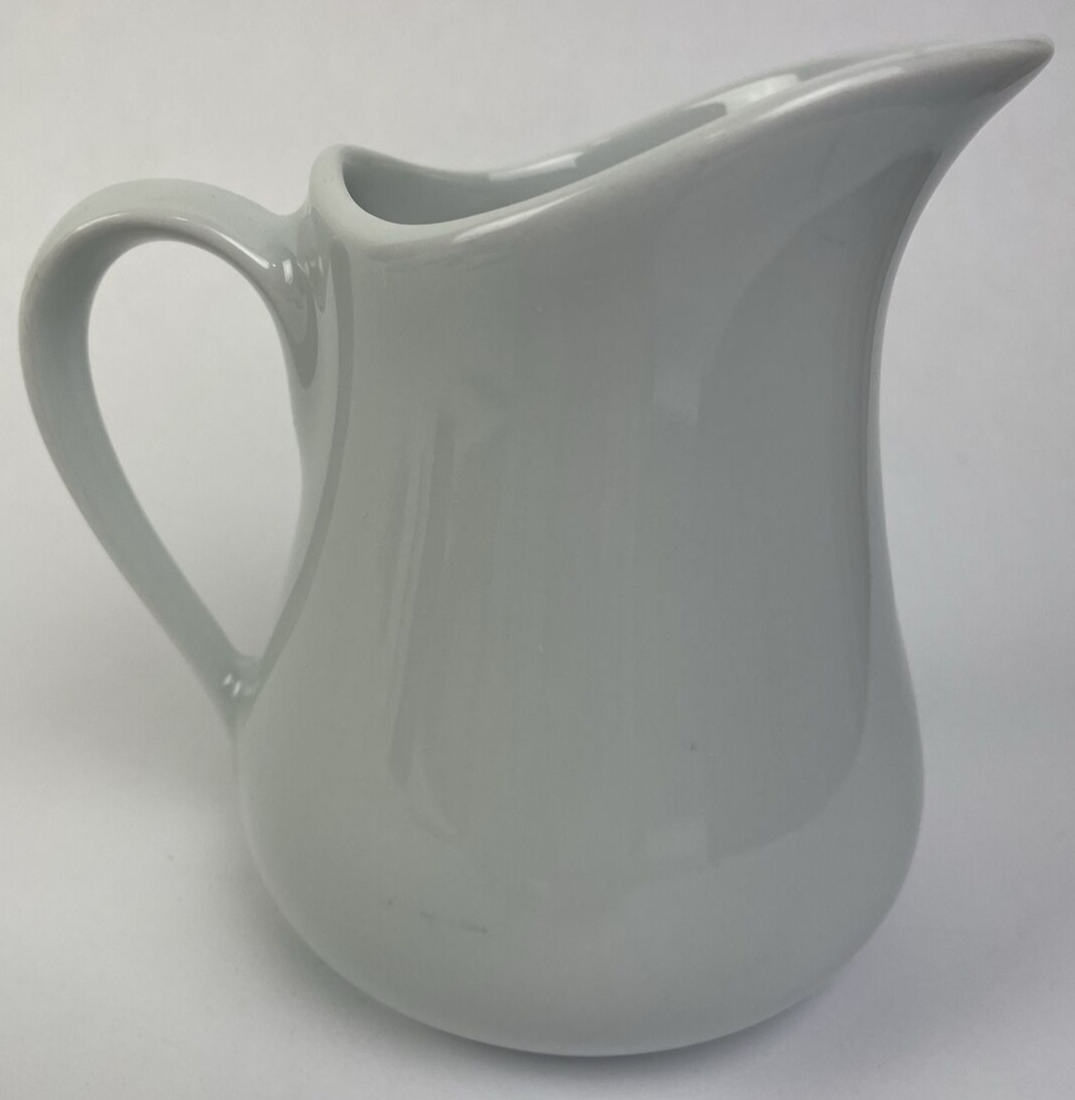 Apilco France Café de Flore 3-inch white porcelain cream pitcher.