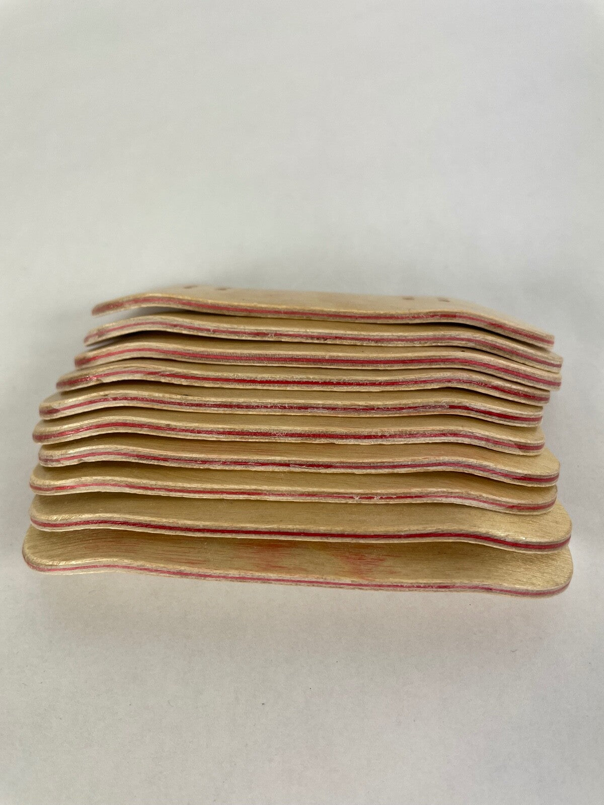 Lot of 10 wooden fingerboard mini skateboards with natural wood grain finish for fingerboarding, crafts, and customization.