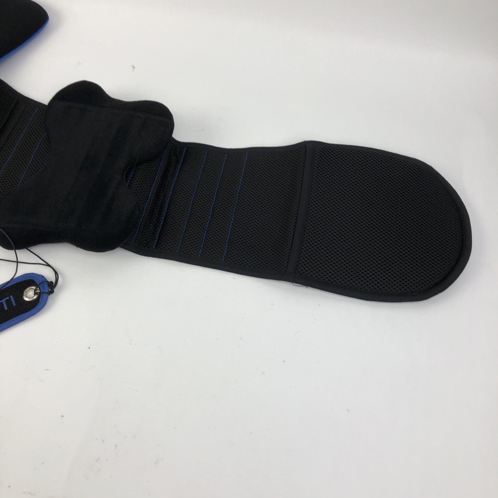 Black unisex lumbar support back brace with pulley adjustment system.