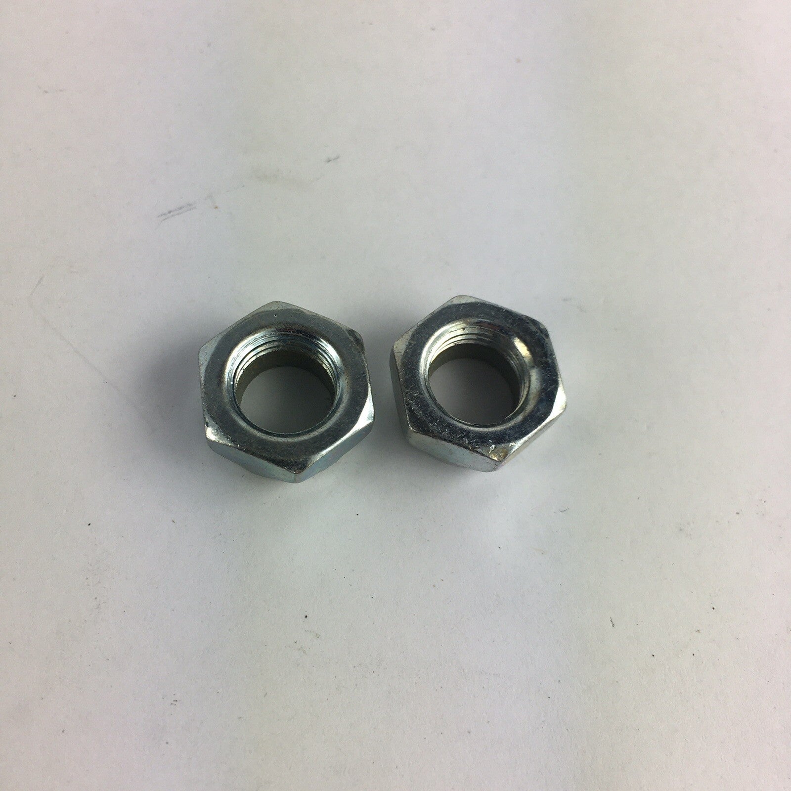 Grind King skateboard truck replacement kingpin lock nuts made from high-strength steel with nylon locking inserts.