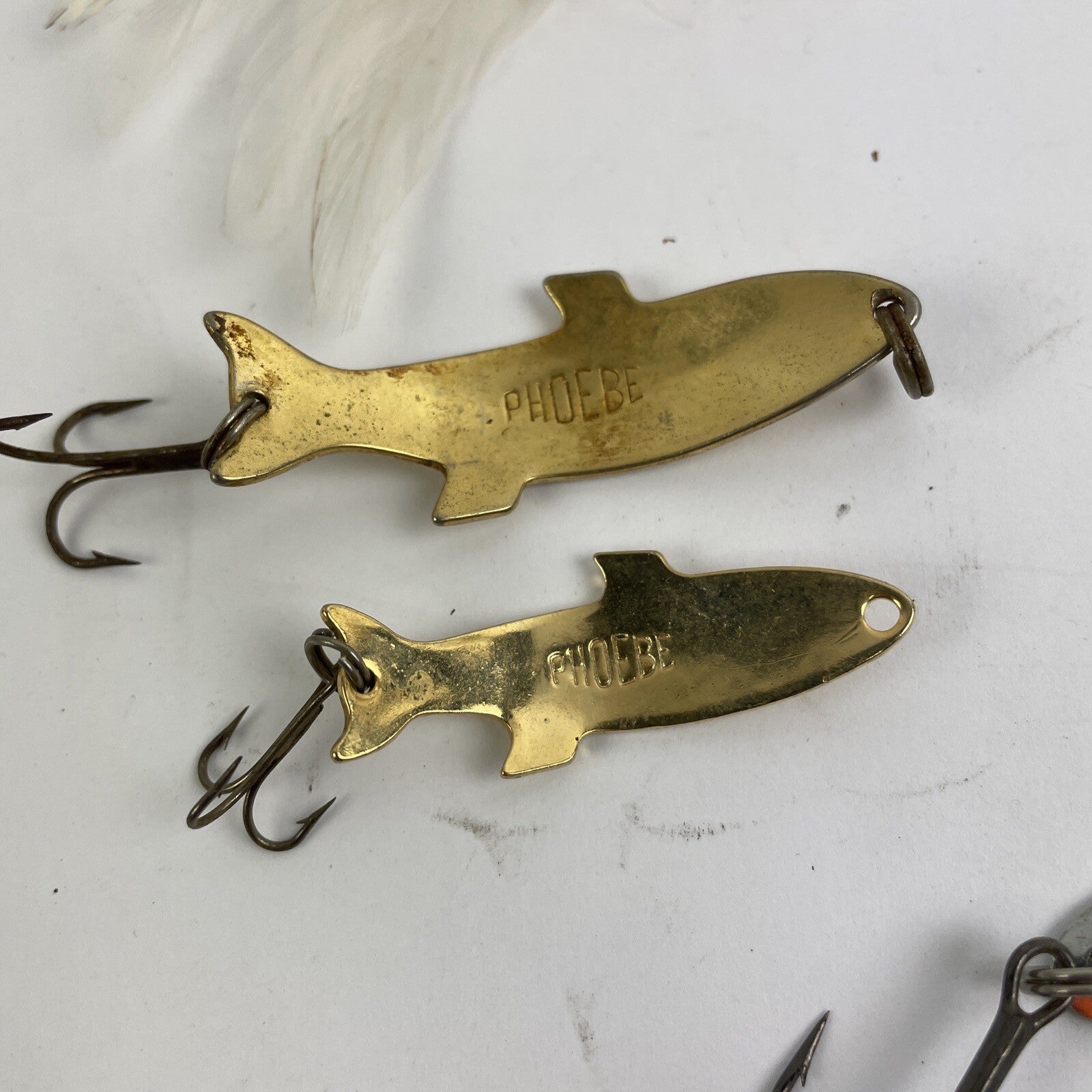 Lot of 22 assorted fishing spoons and spinners including Castmaster, Acme, and Phoebe lures.