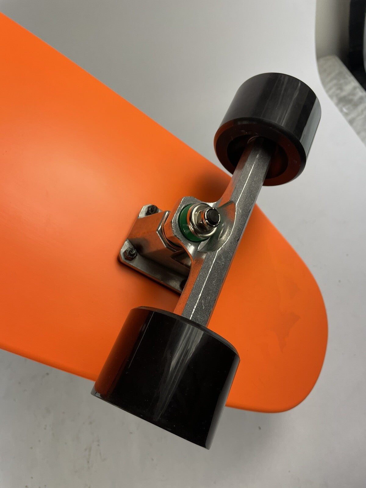 Orange Surf Fish Blank 10-inch complete skateboard with reverse kingpin trucks, 70mm wheels, and ABEC-7 bearings.