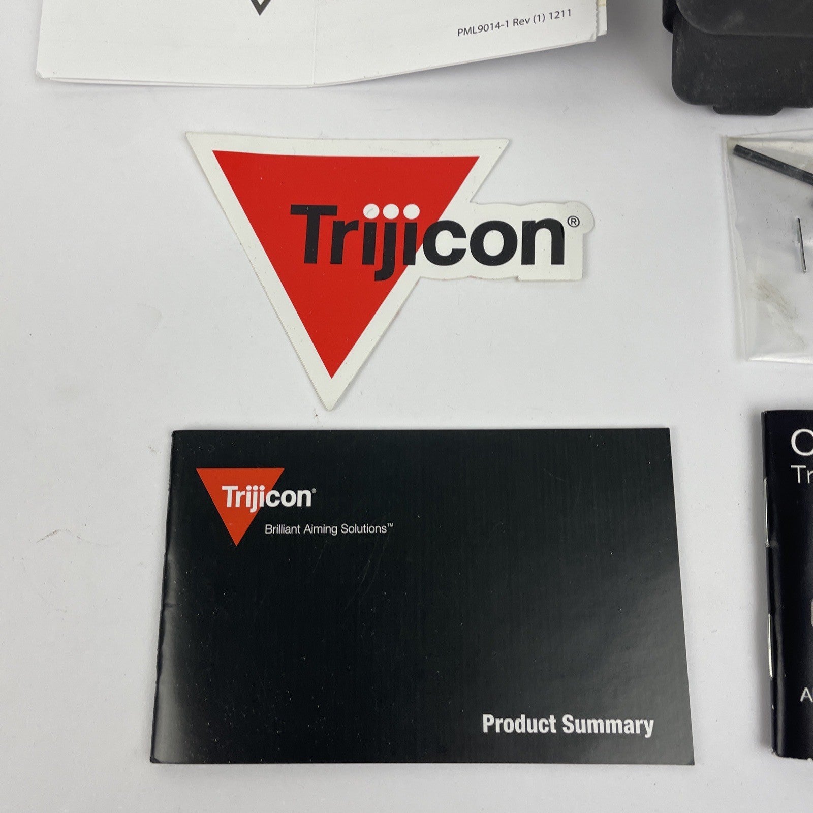 Trijicon OEM hard travel case with foam insert measuring 5.5 x 5 inches