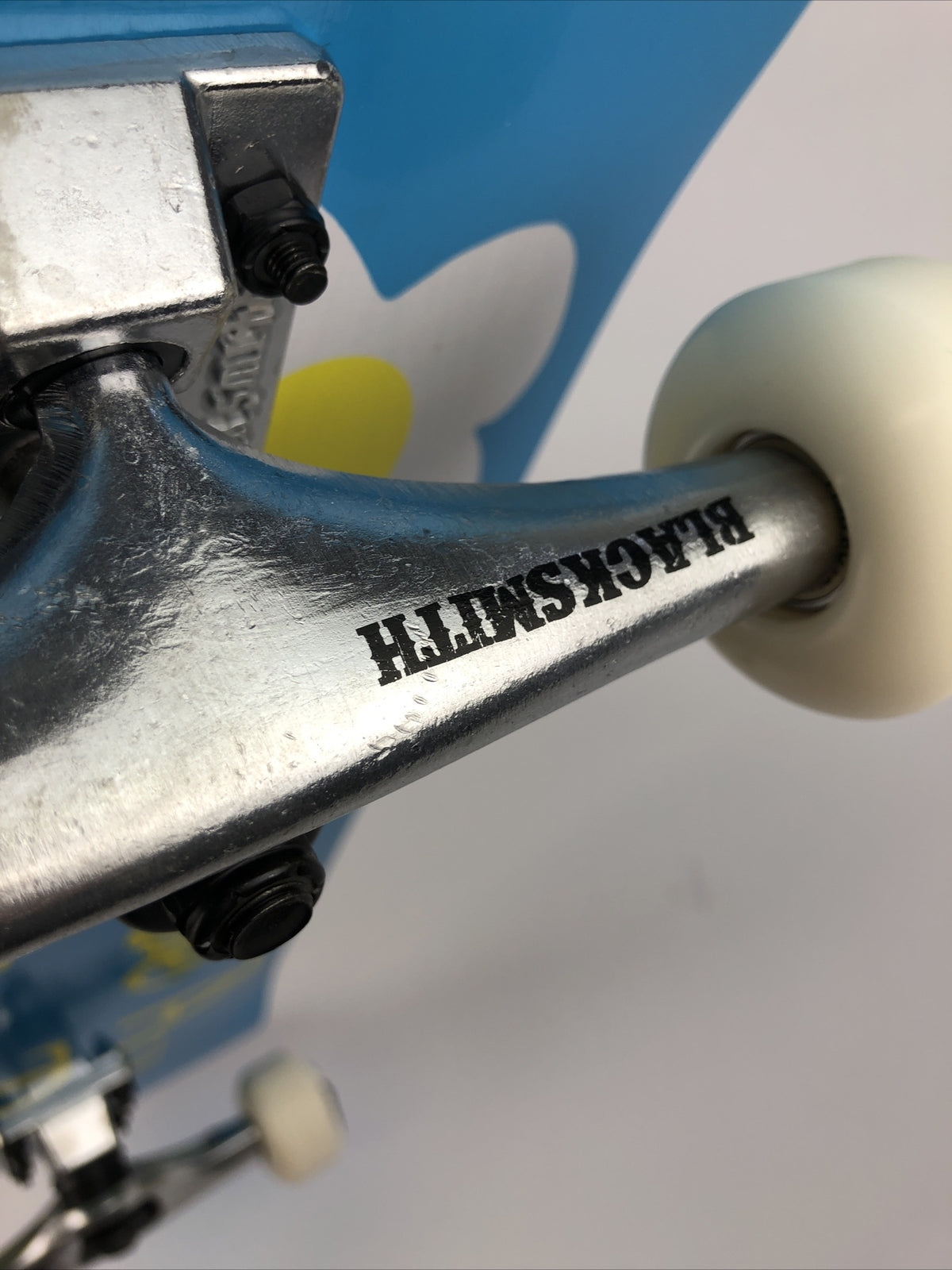ATM Click Have a Nice Day 8-inch complete skateboard with Black Smith trucks and 52mm wheels.