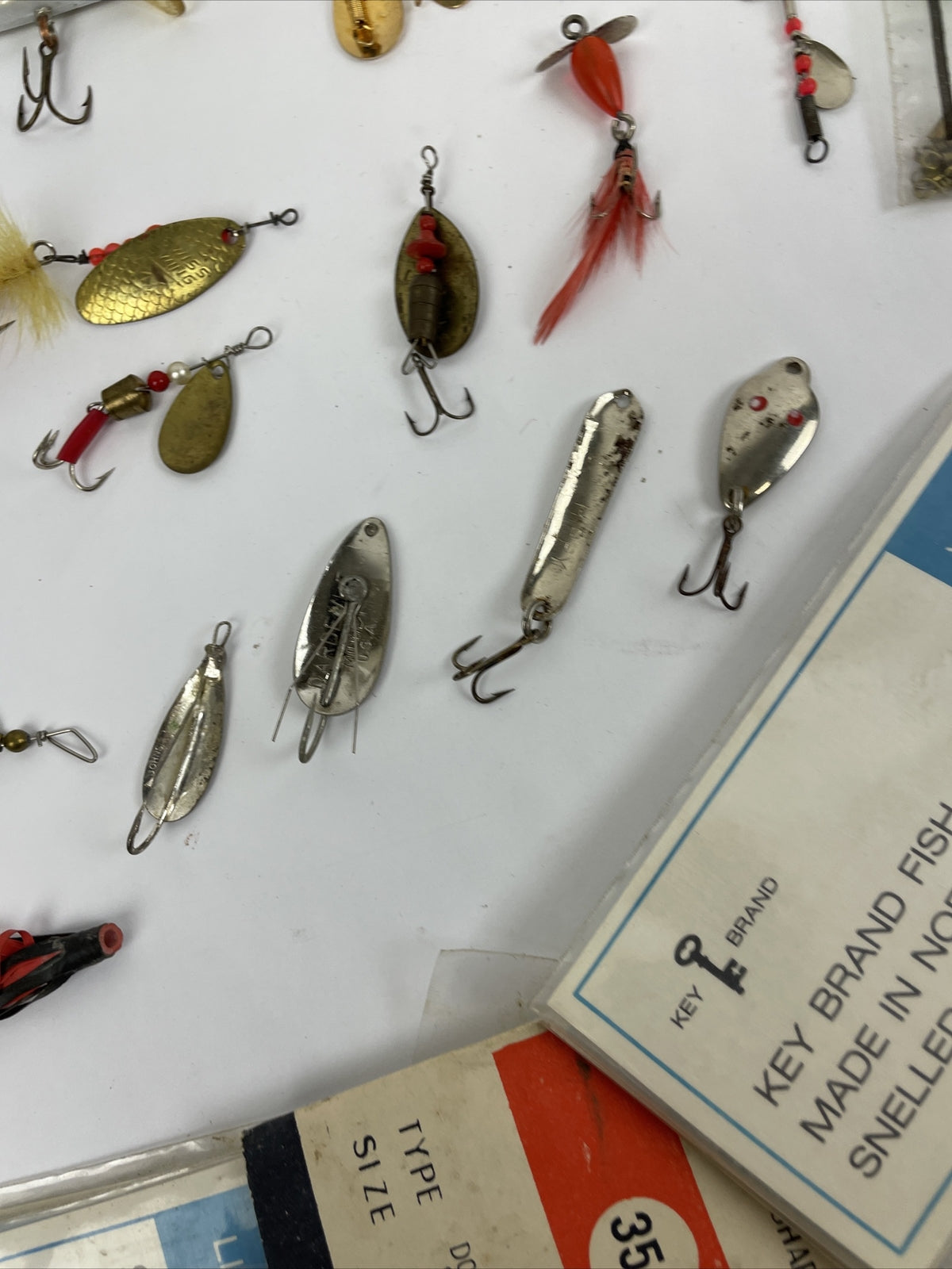 Vintage fishing lure lot with Jitterbug Rebel Floater Mepps and Shyster lures for trout crappie and bass fishing