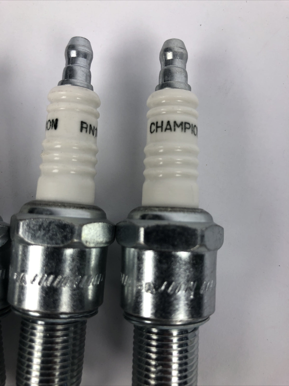 Lot of 7 Champion RN14YC spark plugs NAPA 405 replacement ignition set automotive engine tune up plugs