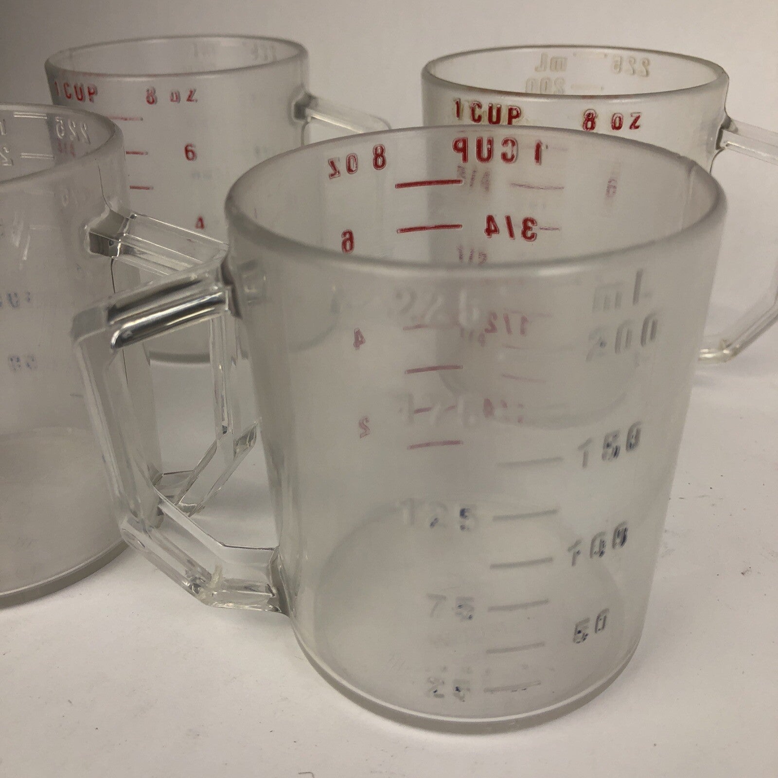 Set of four Cambro Camwear clear 1 cup measuring cups made in the USA.