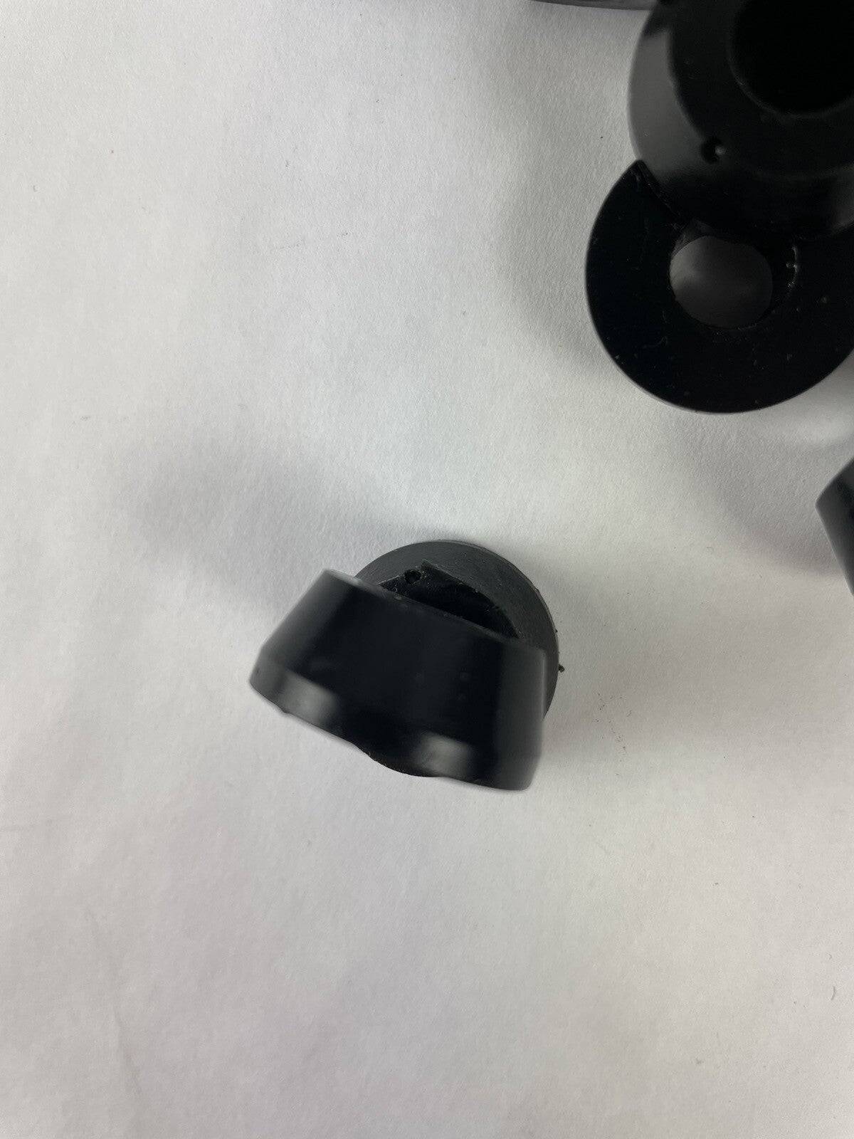 Black skateboard truck upper replacement bushings bulk kit with 20 polyurethane pieces for standard skateboard trucks.
