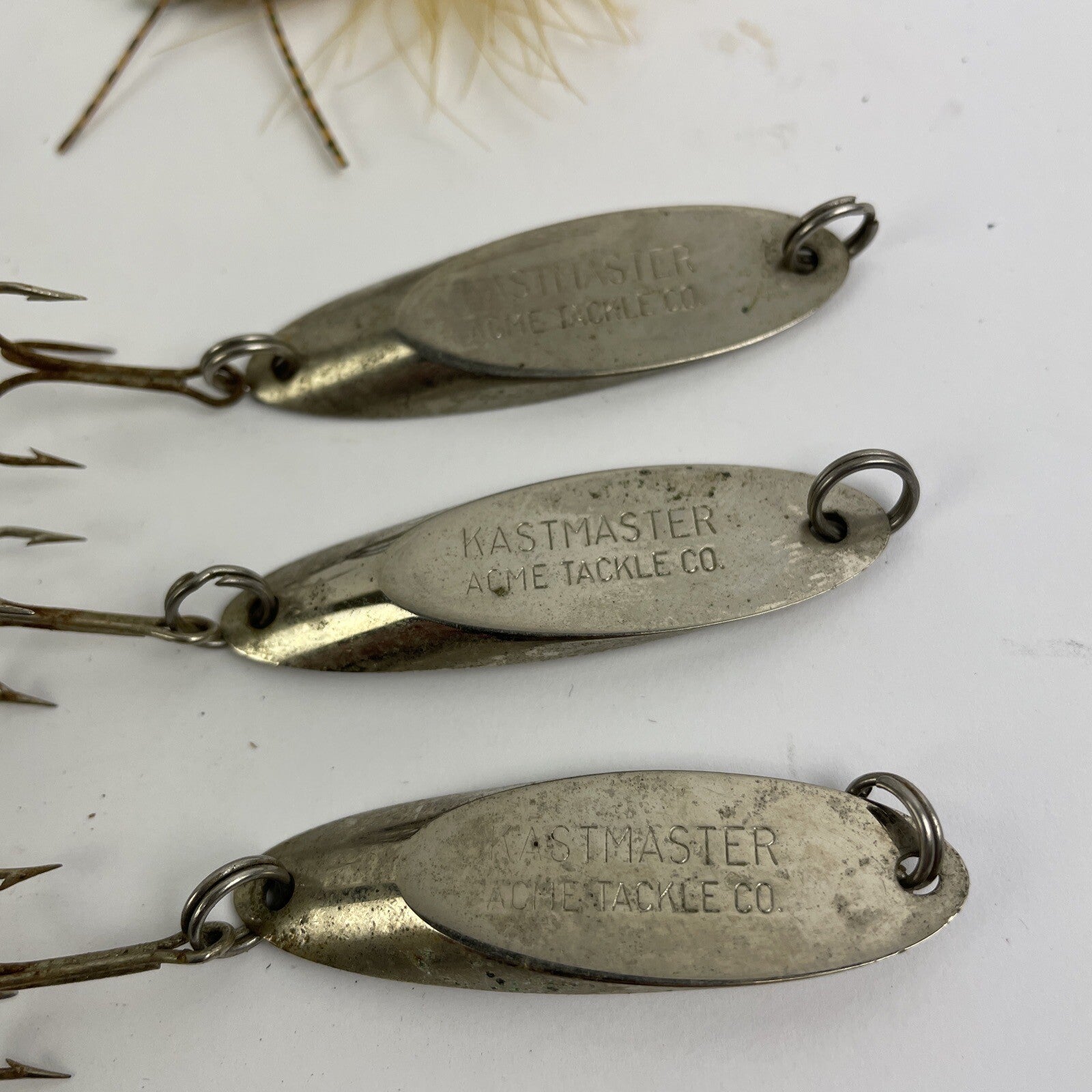 Lot of 22 assorted fishing spoons and spinners including Castmaster, Acme, and Phoebe lures.