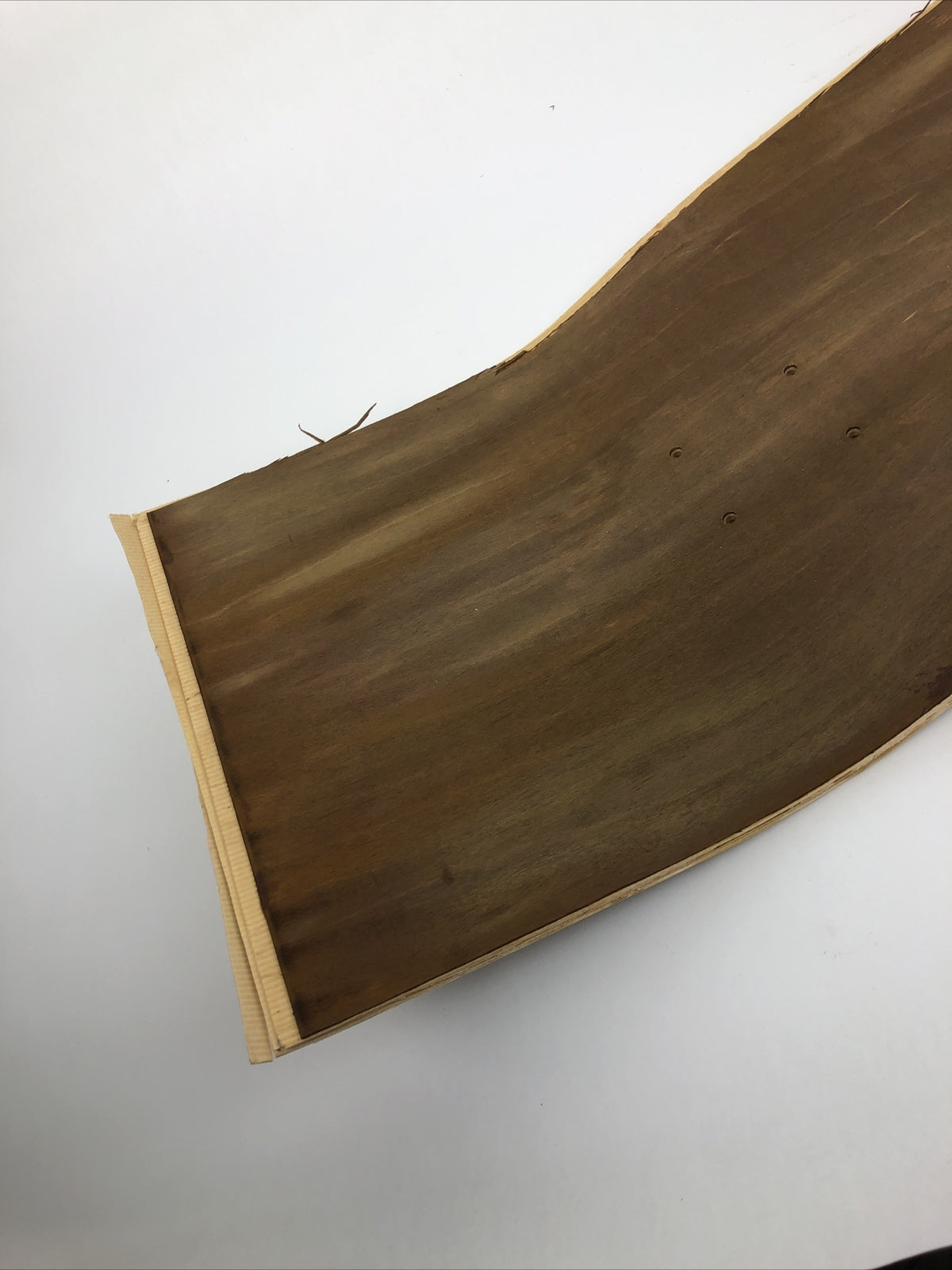 Blank uncut brown stain skateboard deck 10 x 34 inches with 14.25-inch pre-drilled wheelbase.