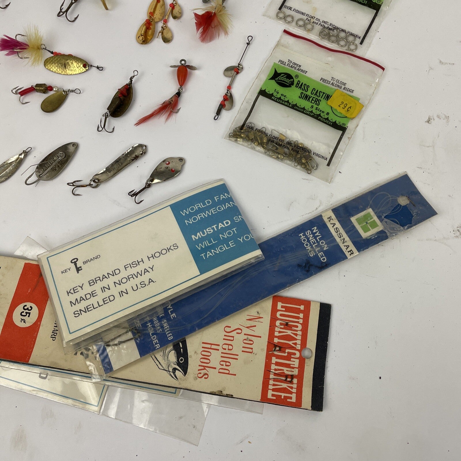 Vintage fishing lure lot with Jitterbug Rebel Floater Mepps and Shyster lures for trout crappie and bass fishing