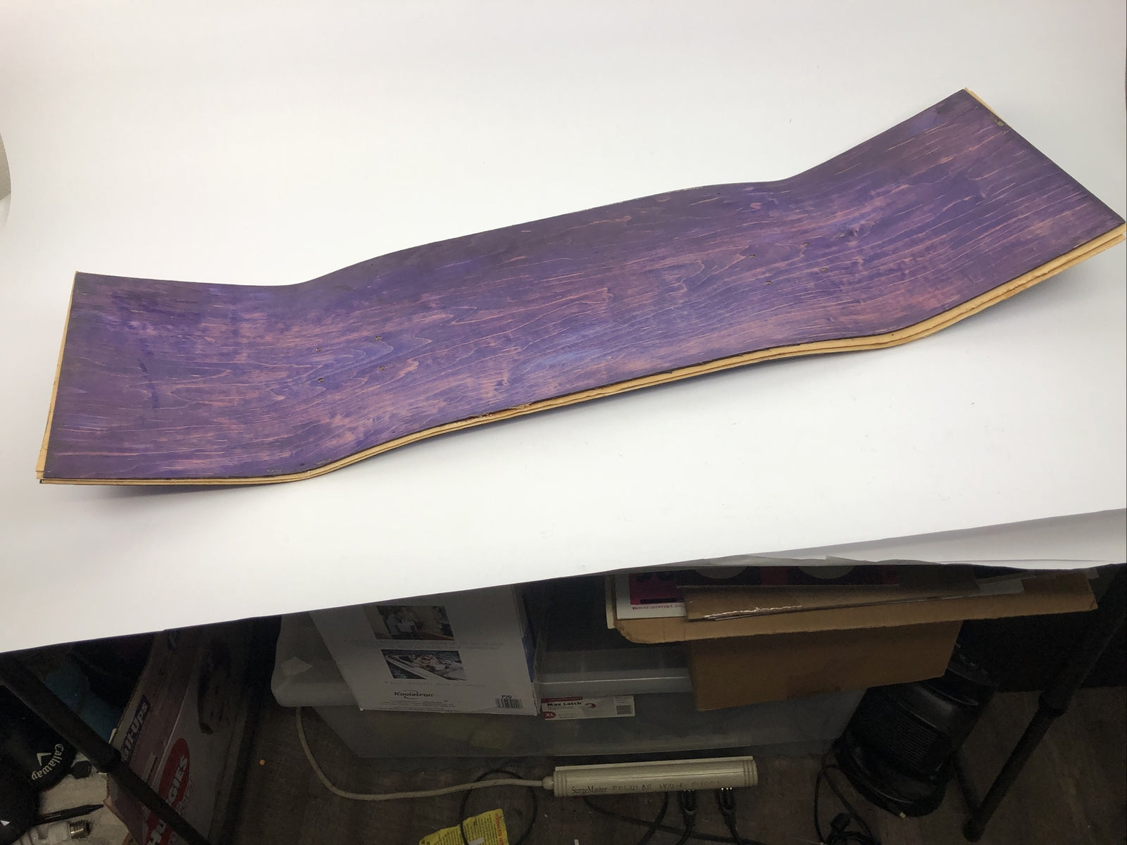 Blank uncut purple stain skateboard deck 10 x 34 inches with 14.25-inch pre-drilled wheelbase.