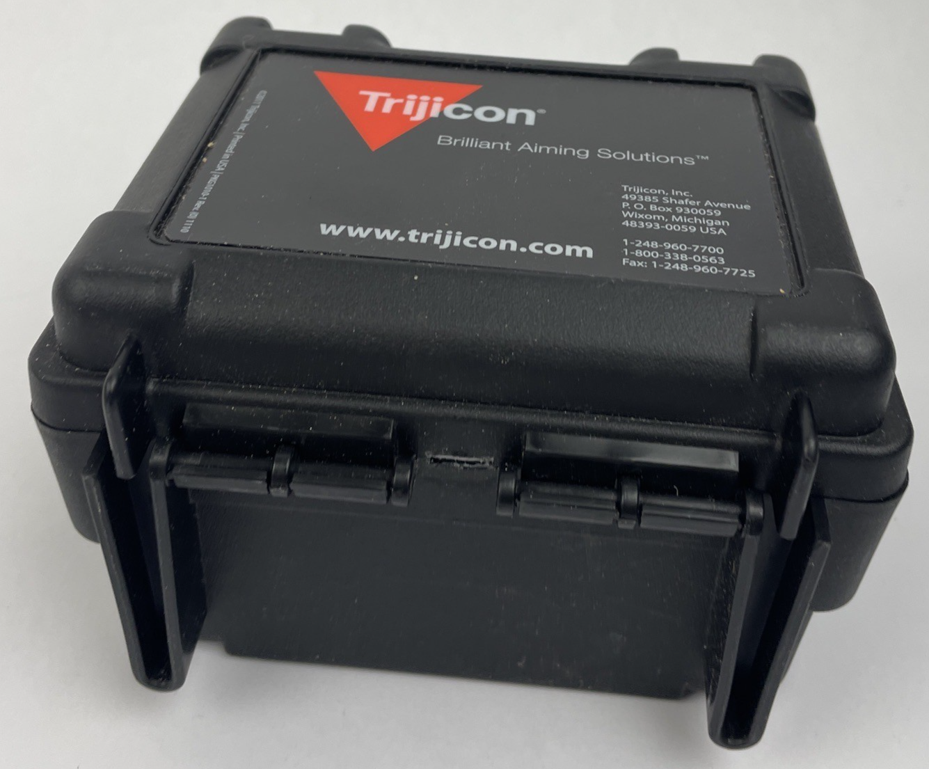 Trijicon OEM hard travel case with foam insert measuring 5.5 x 5 inches