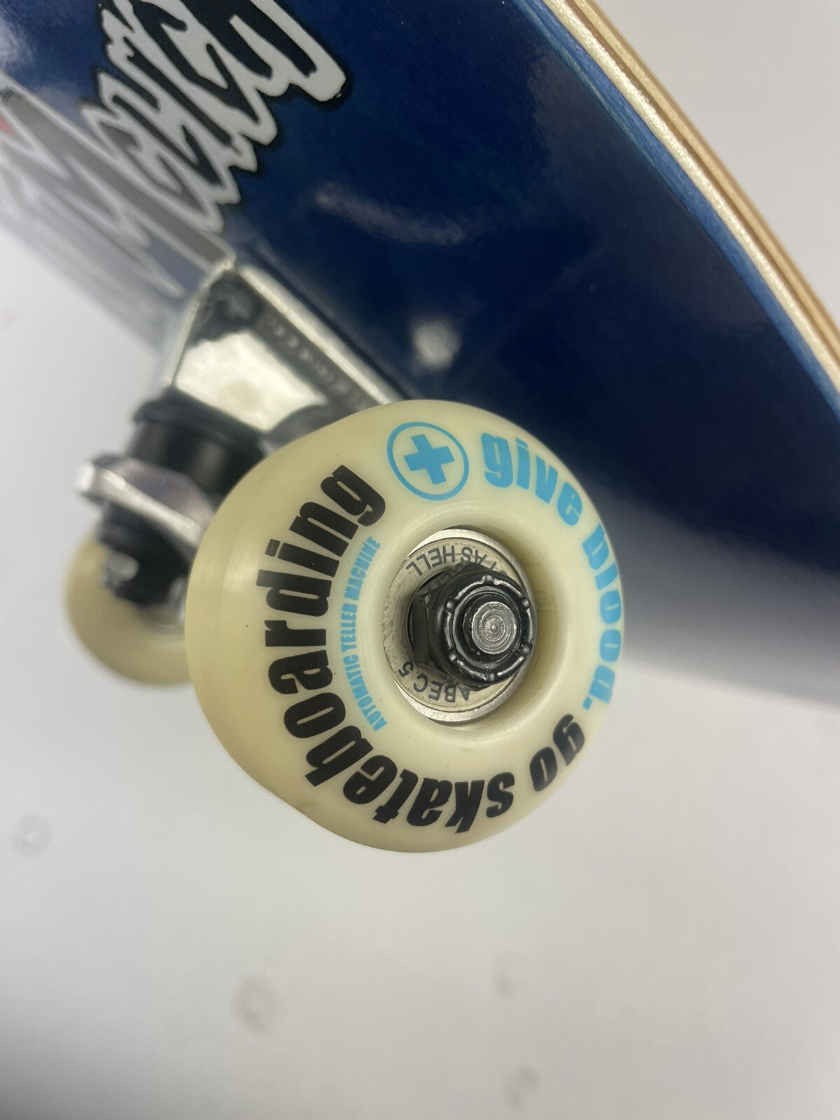 ATM Click Stay Strong 8-inch complete skateboard with Black Smith trucks and 52mm wheels.