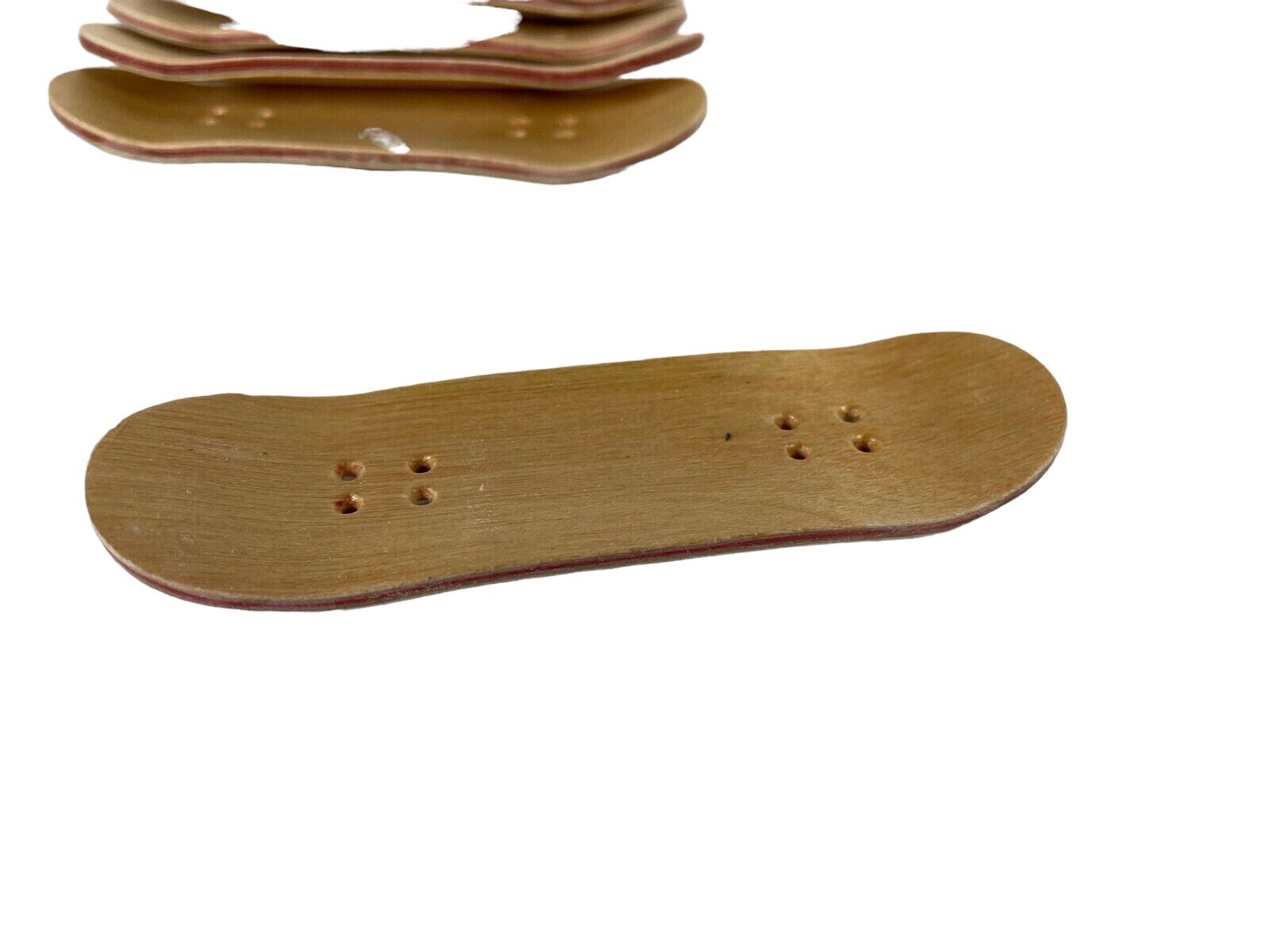 Lot of 10 premium wooden fingerboards with natural wood grain finish.