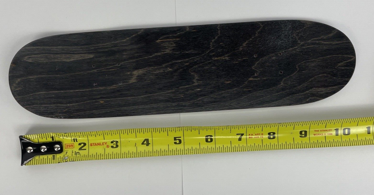 Blank Canadian maple mini hand skateboard deck measuring 10.5 x 2.75 inches with a 4.25-inch wheelbase.