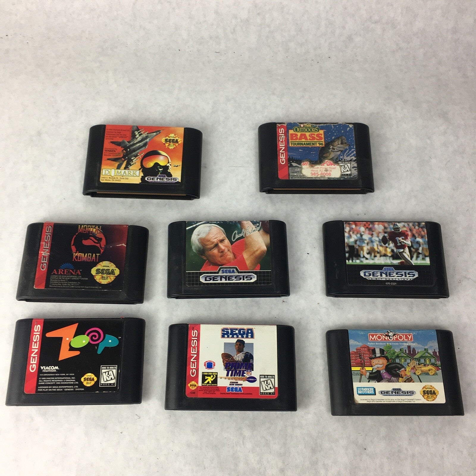 Lot of 8 authentic Sega Genesis games including Mortal Kombat Zoop MIG-29 Monopoly and Outdoor Bass
